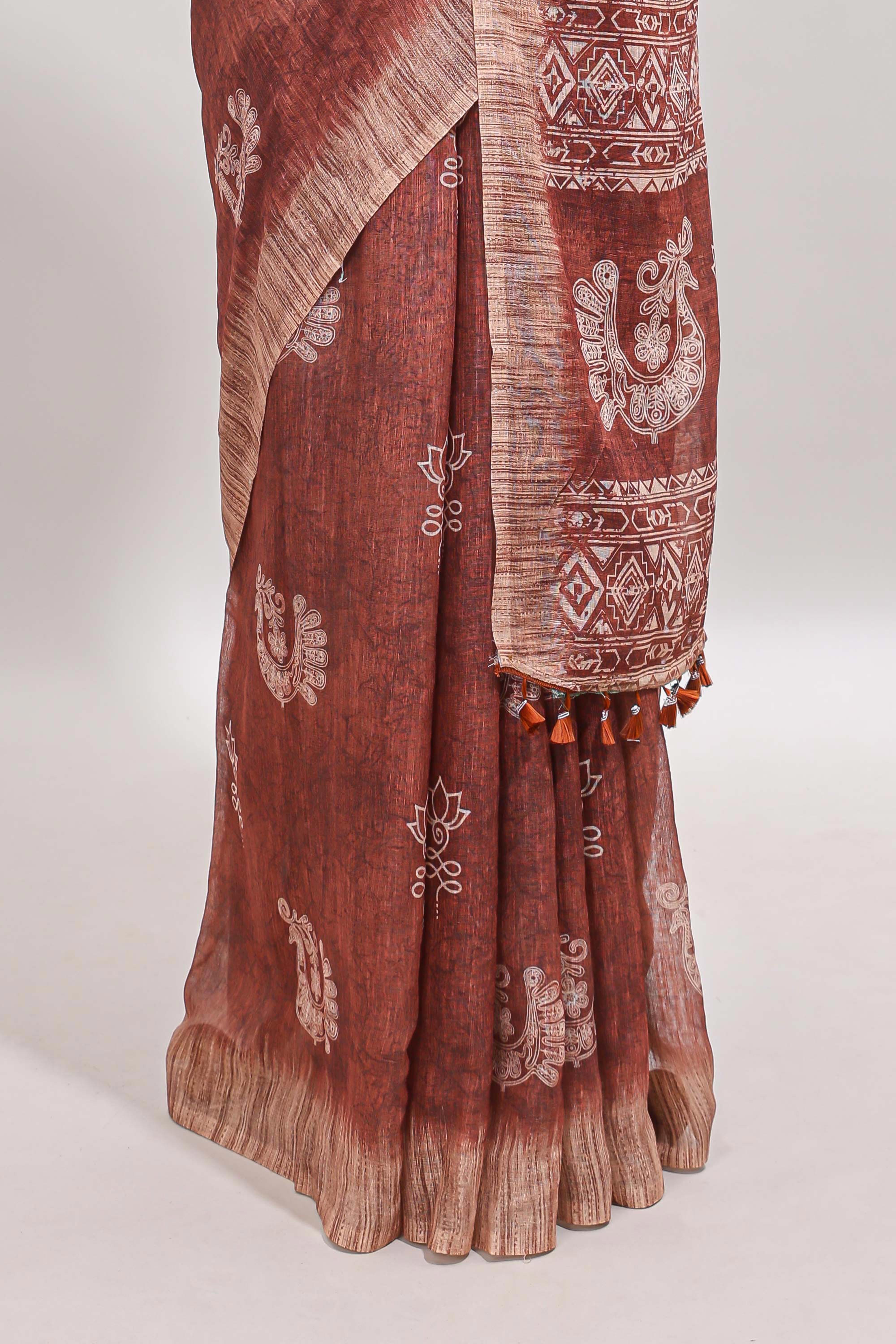 Brown peacock & floral motifs linen cotton saree with contrast border and matching blouse