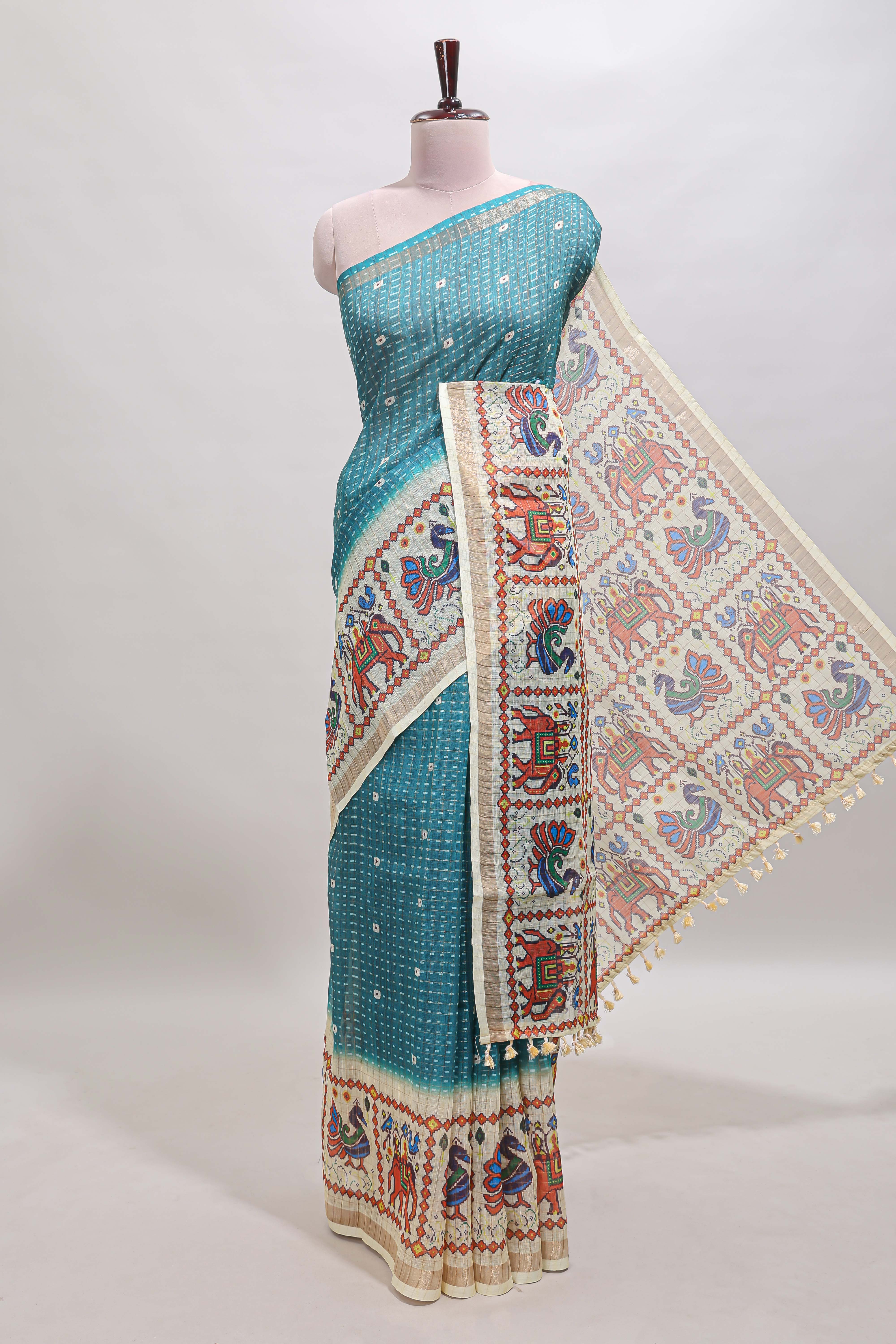 Turquoise blue checked geometric motifs linen cotton saree with contrast ikkat style border and blouse