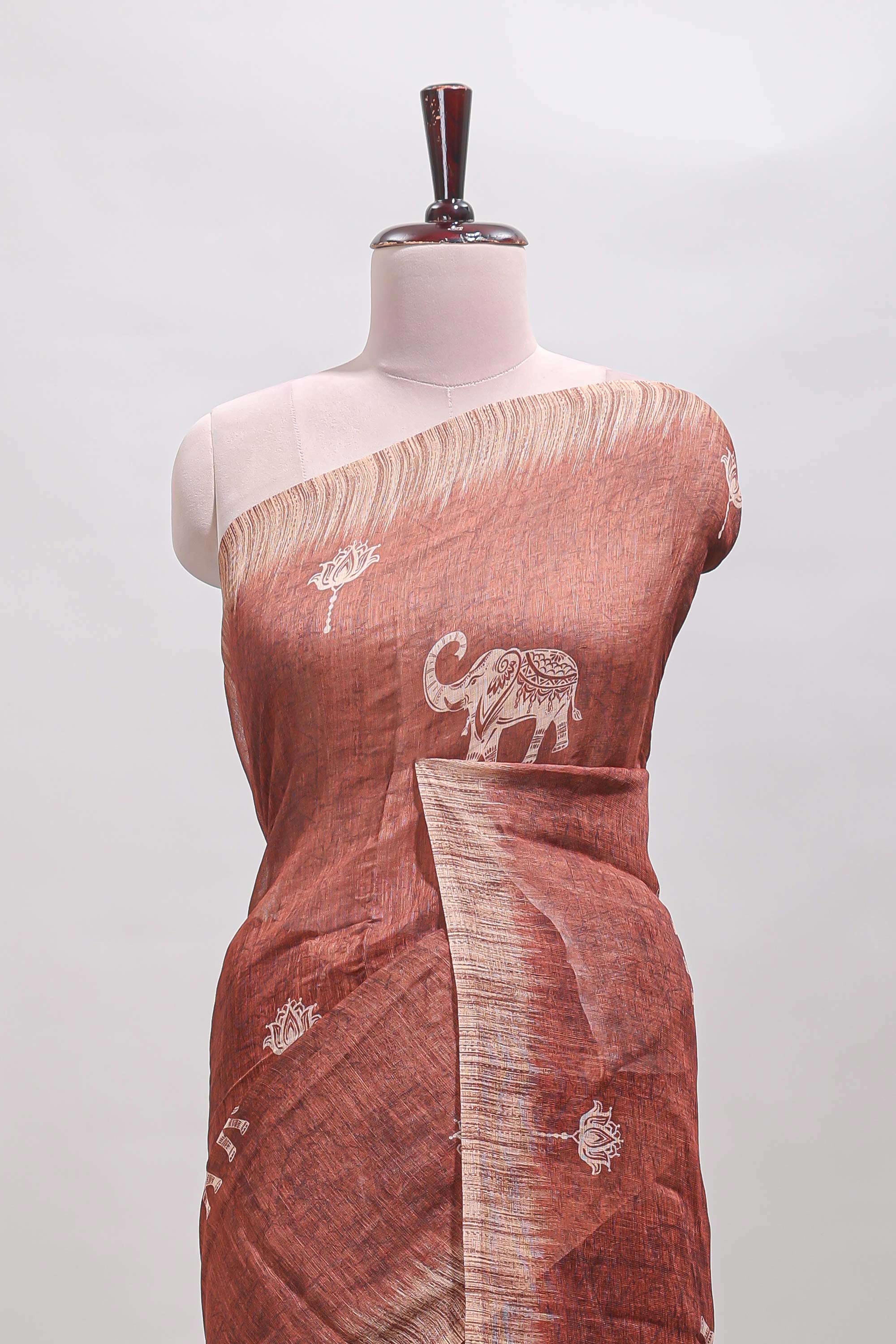 Brown floral & elephant motifs linen cotton with contrast border and matching blouse