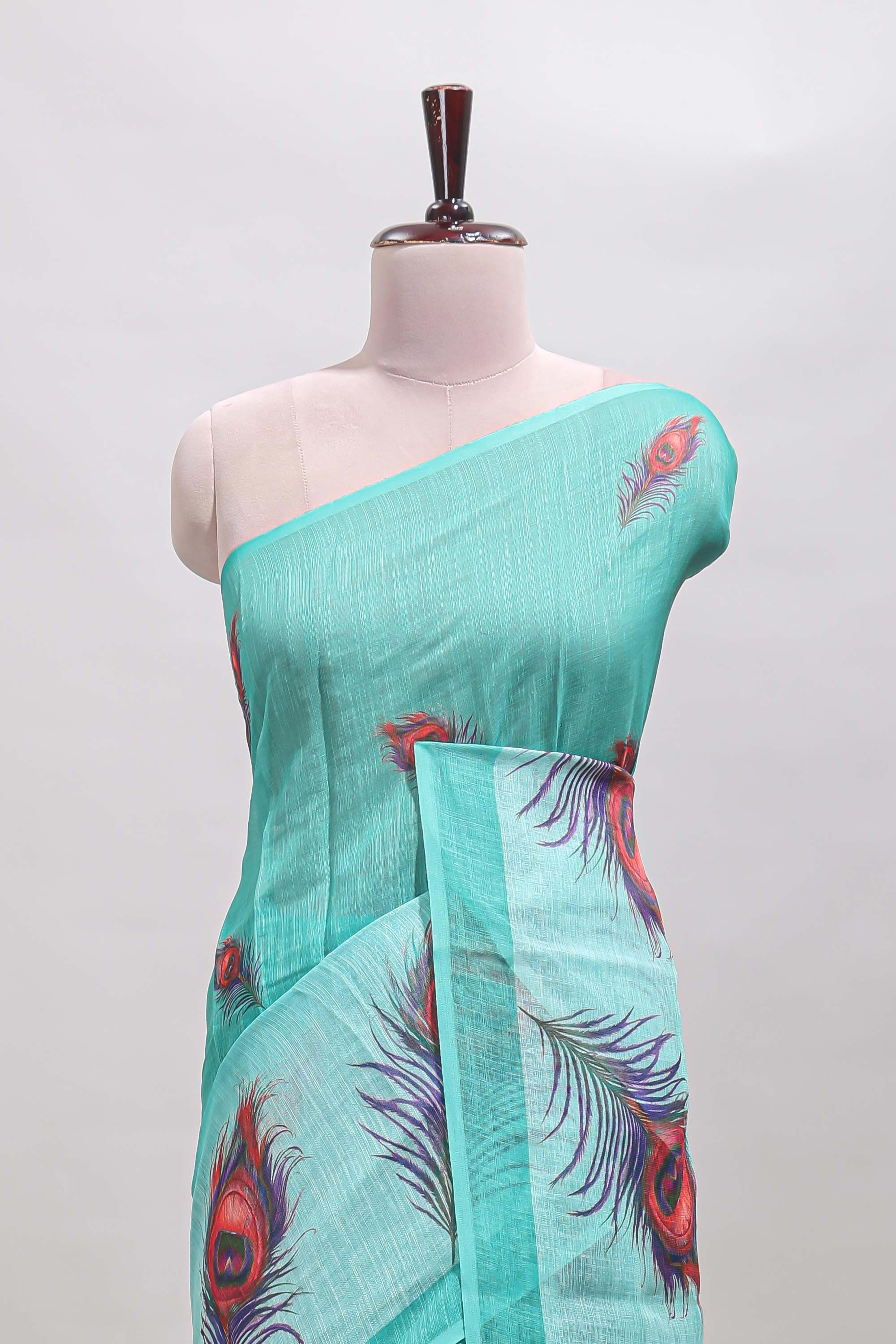 Green peacock feather motifs linen cotton saree with self border and matching blouse