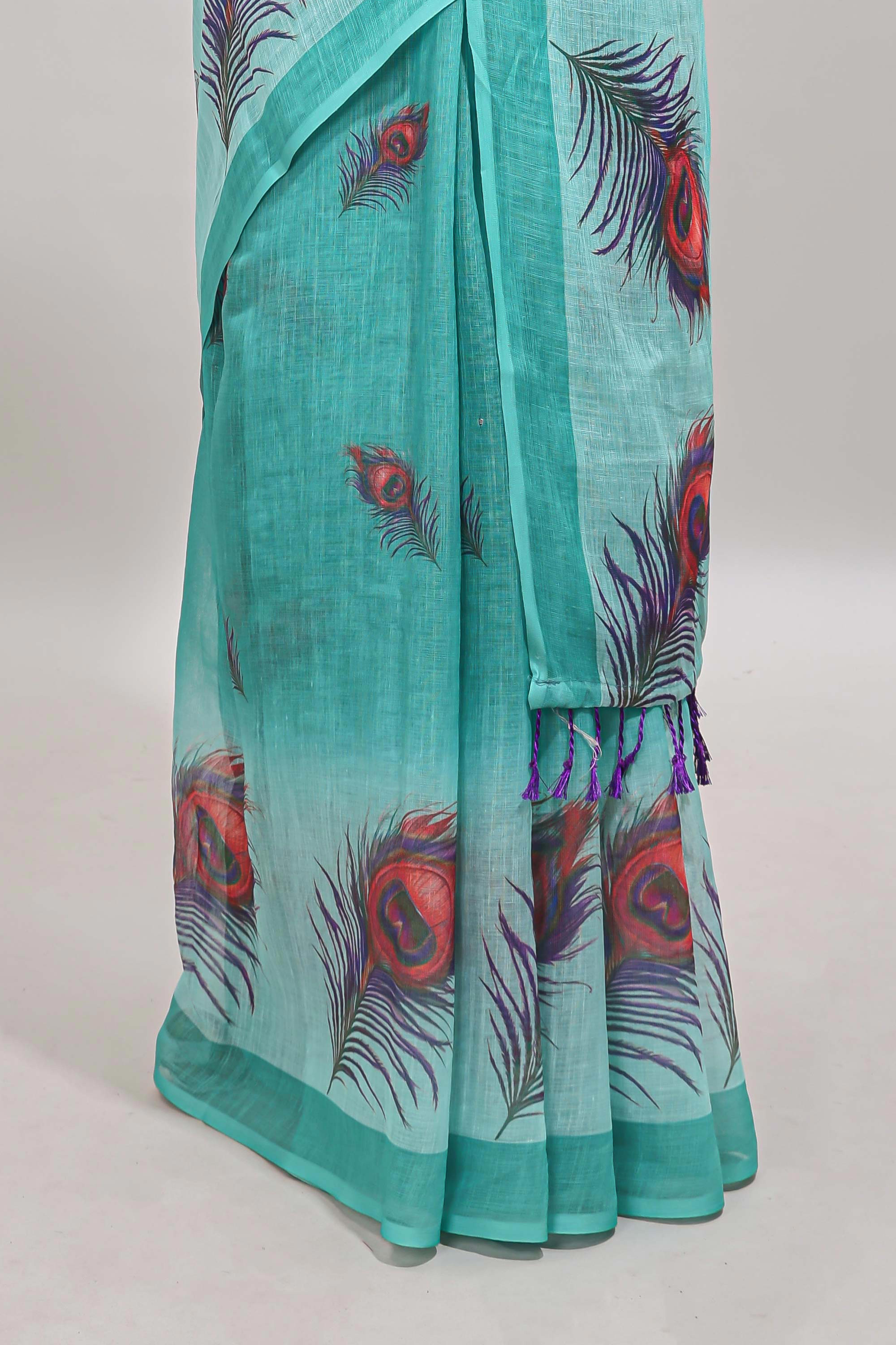 Green peacock feather motifs linen cotton saree with self border and matching blouse