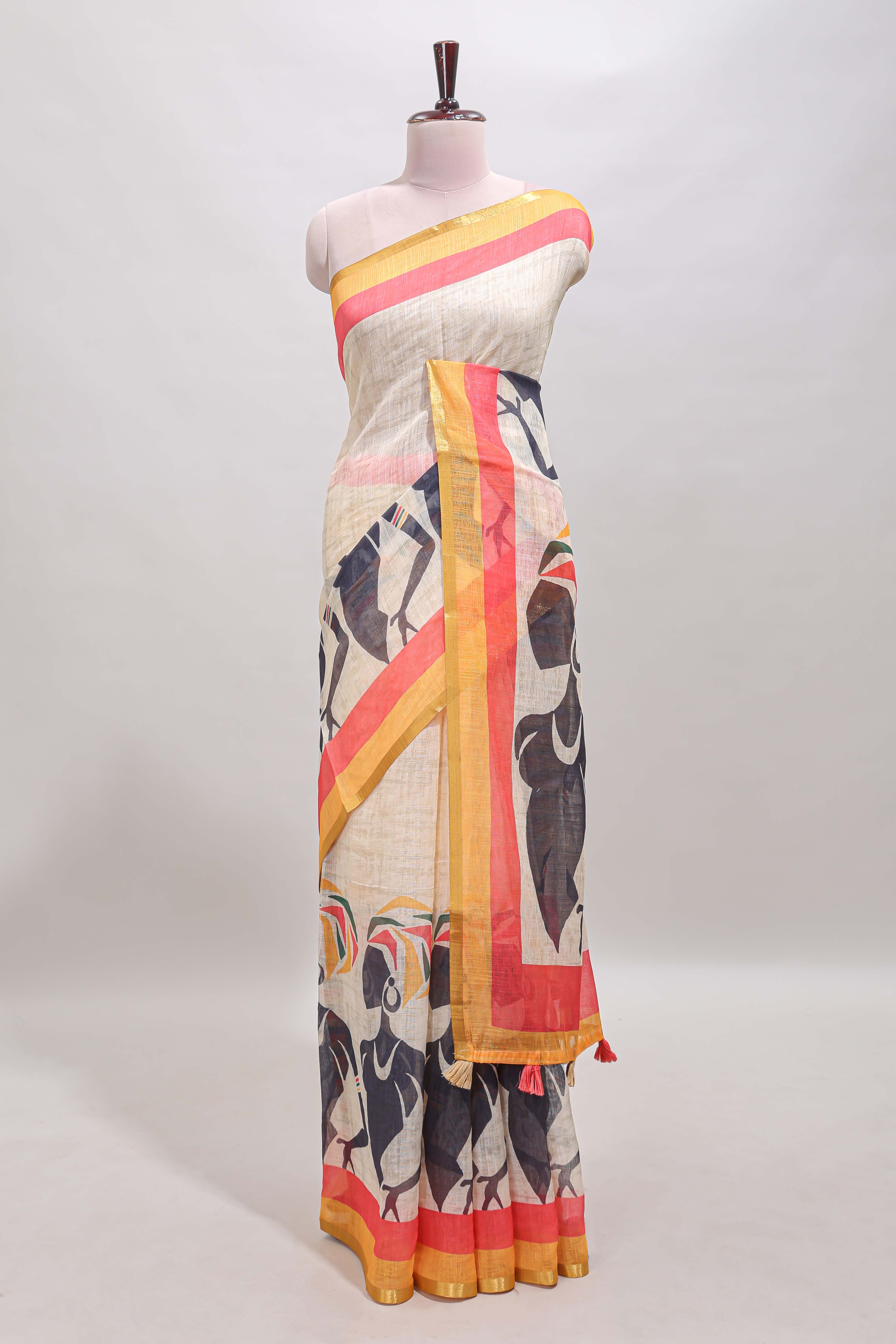 Beige artistic traditional tribal print linen cotton saree with contrast border and multi color blouse