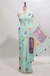 Pista green floral design linen cotton saree with self zari border and contrast blouse