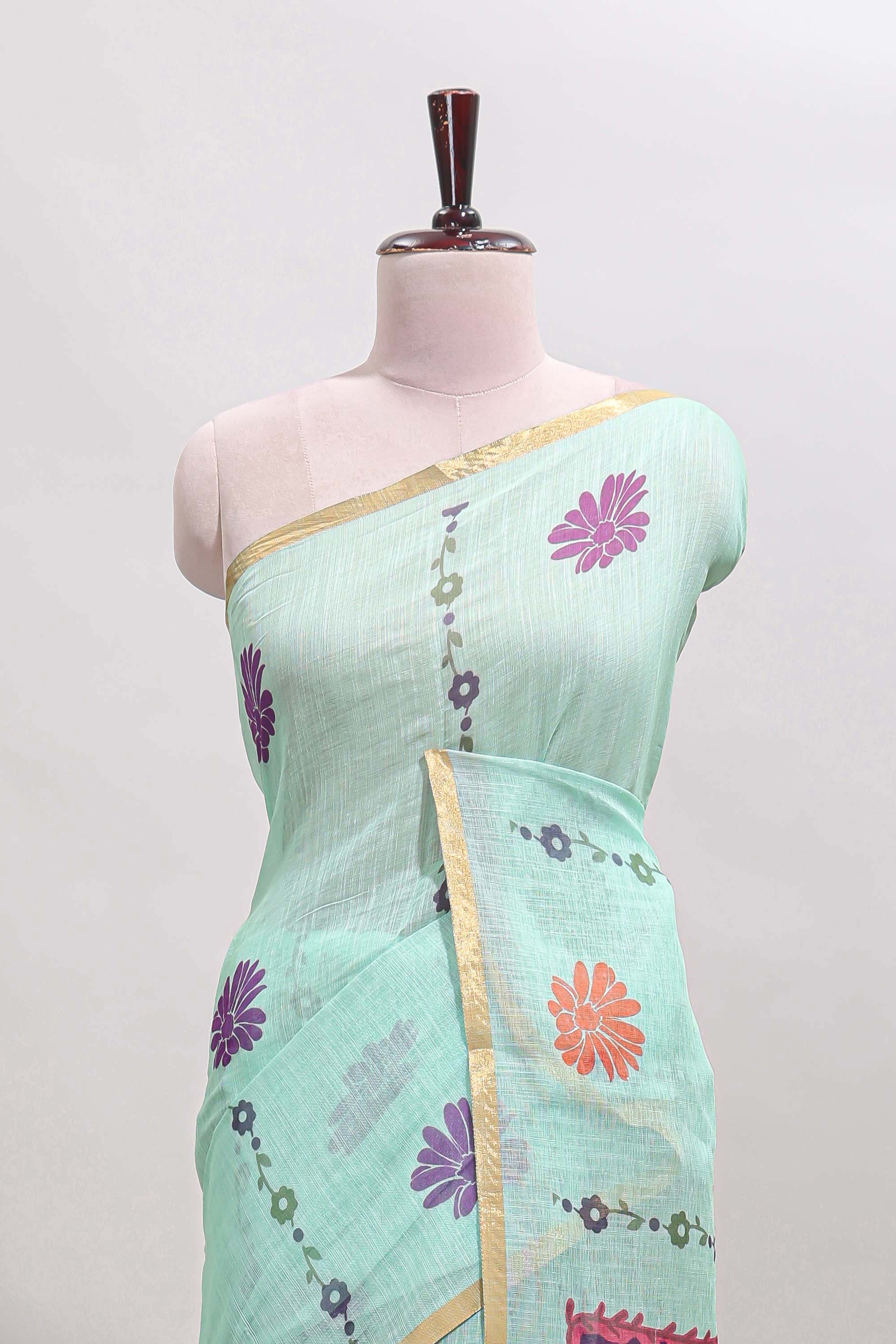 Pista green floral design linen cotton saree with self zari border and contrast blouse