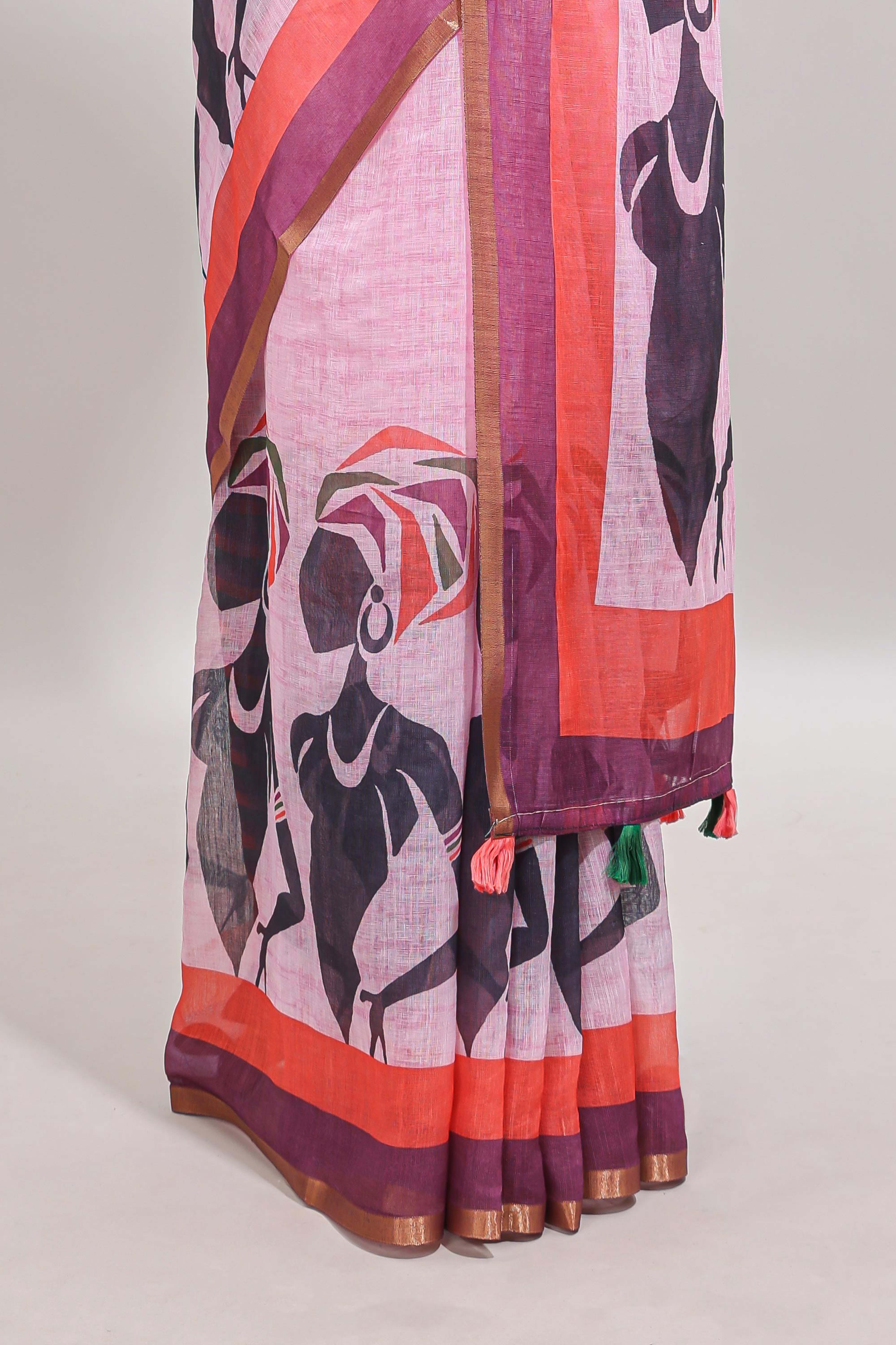 Light pink artistic traditional tribal print linen cotton saree with contrast border and striped blouse