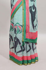 Light green artistic traditional tribal print linen cotton saree with contrast border and striped blouse