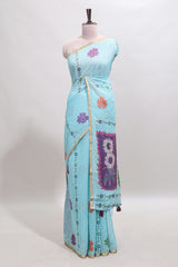 Blue floral design linen cotton saree with self zari border and contrast blouse