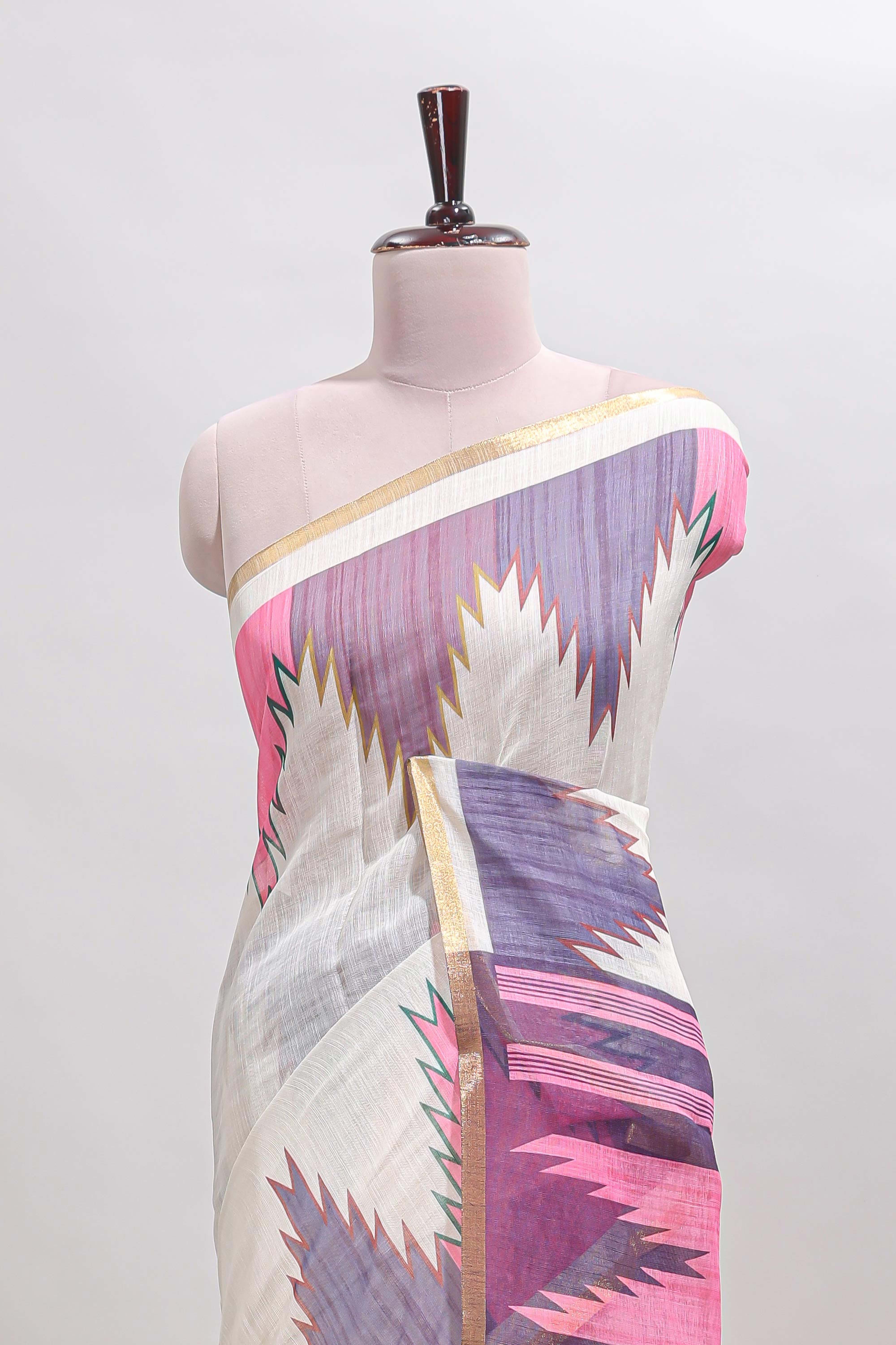 Cream ikkat style linen cotton saree with self zari border and contrast blouse