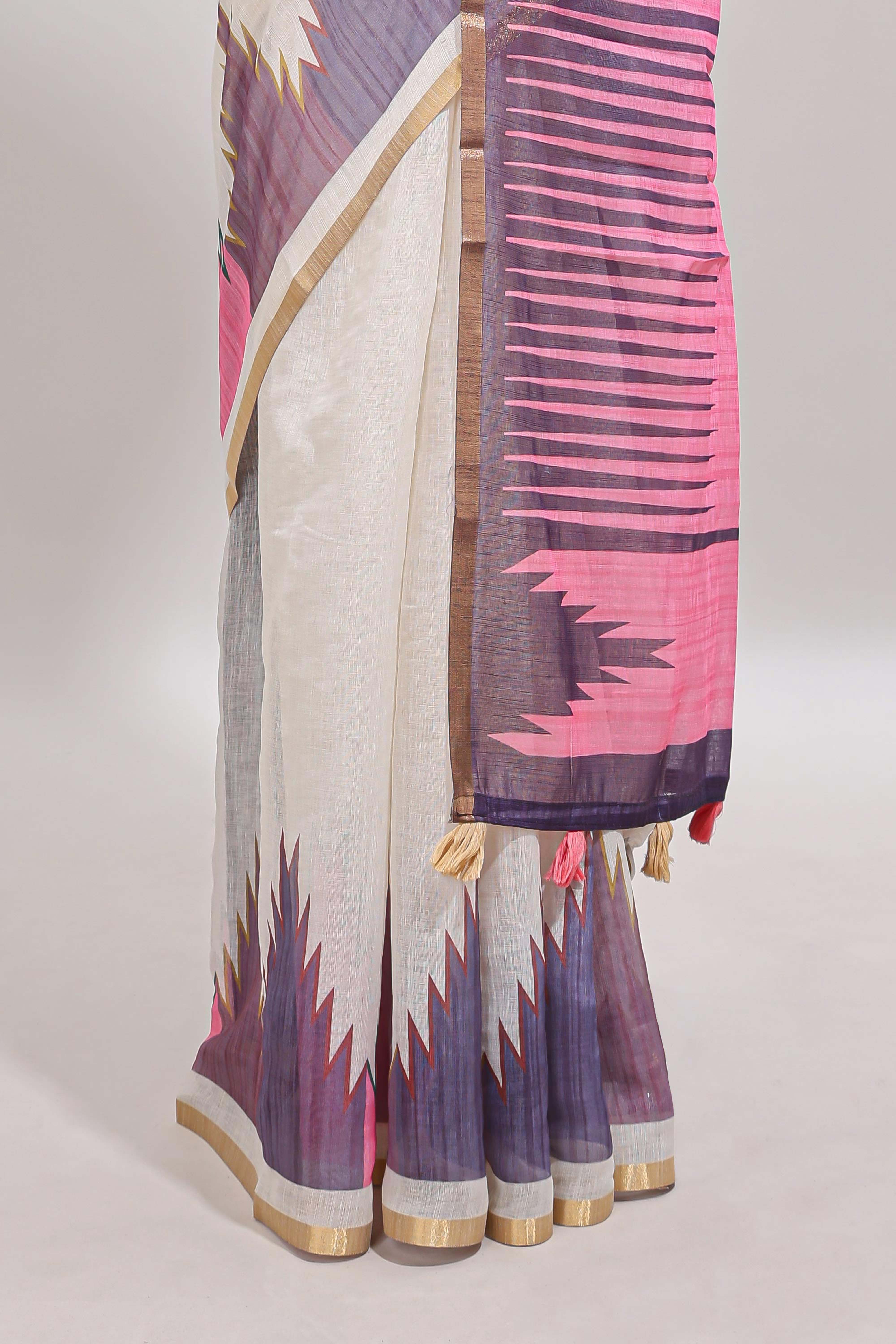Cream ikkat style linen cotton saree with self zari border and contrast blouse