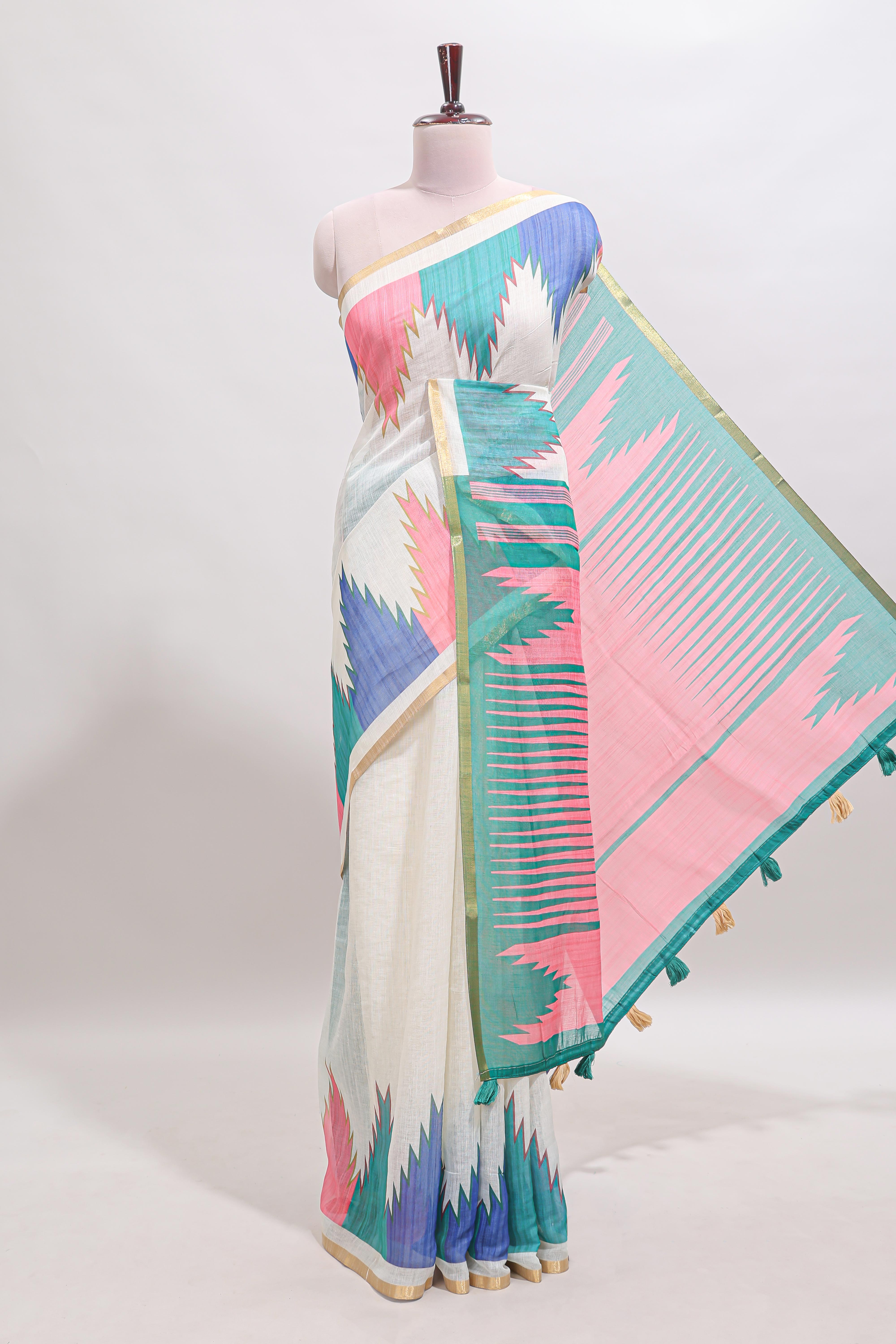 Cream ikkat style linen cotton saree with self zari border and contrast blouse