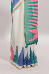 Cream ikkat style linen cotton saree with self zari border and contrast blouse