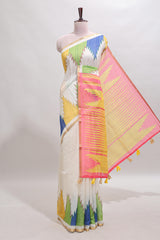 Cream ikkat style linen cotton saree with self zari border and contrast blouse