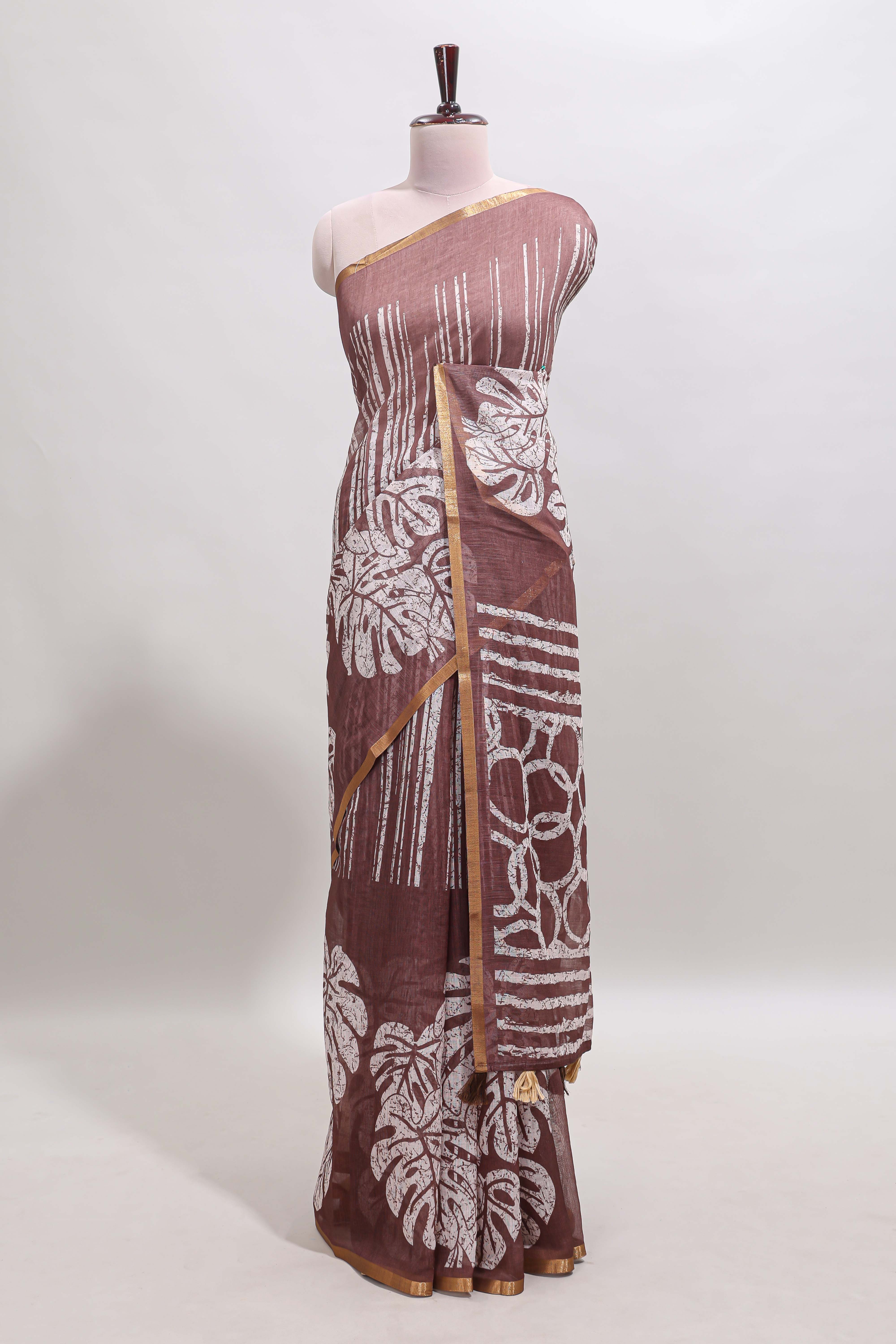 Brown striped & leaf design linen cotton saree with self zari border and contrast blouse