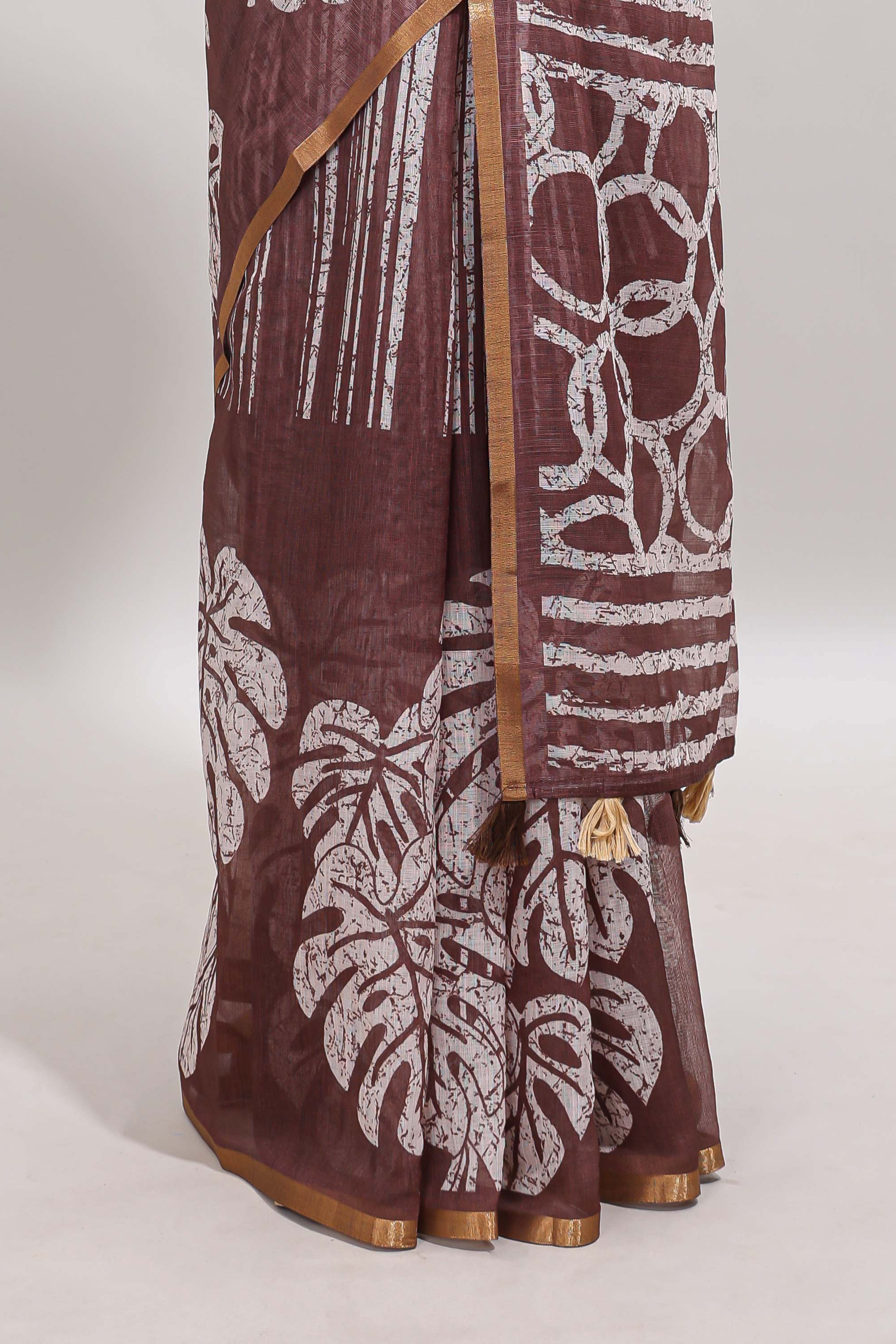 Brown striped & leaf design linen cotton saree with self zari border and contrast blouse