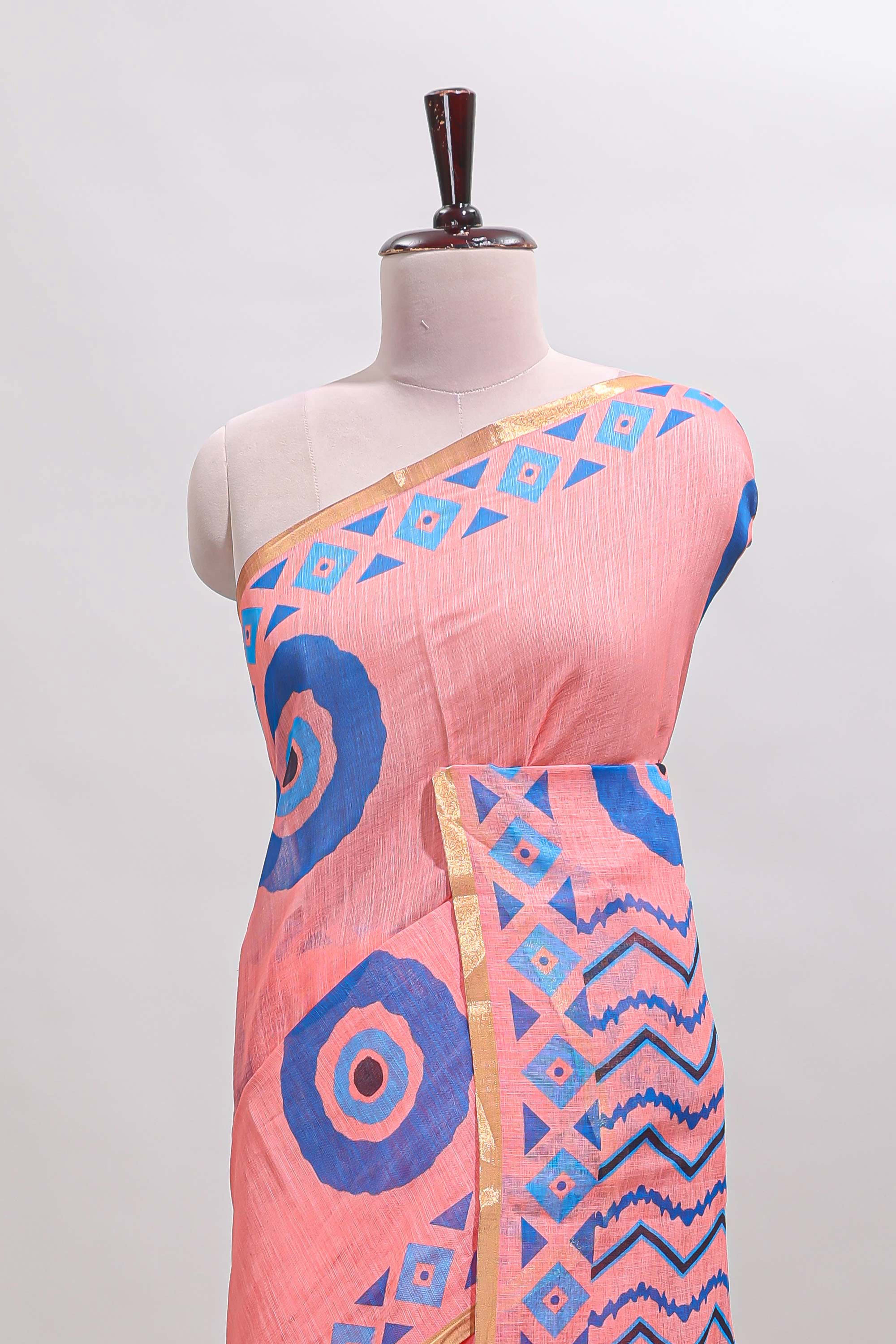 Orange nazar print motifs design linen cotton saree with self zari border and contrast blouse