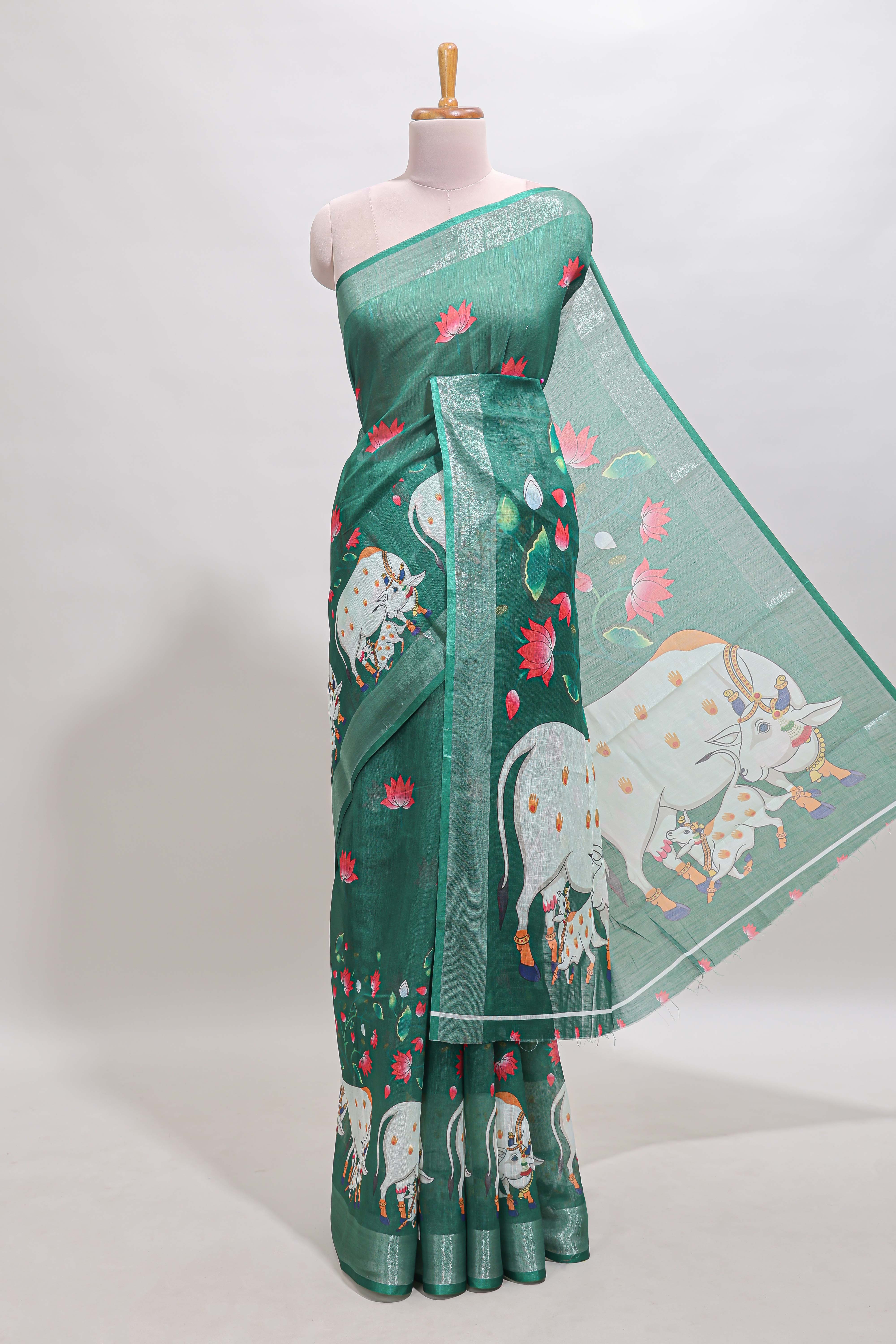 Green floral & cow design linen cotton saree with self silver zari border and matching blouse