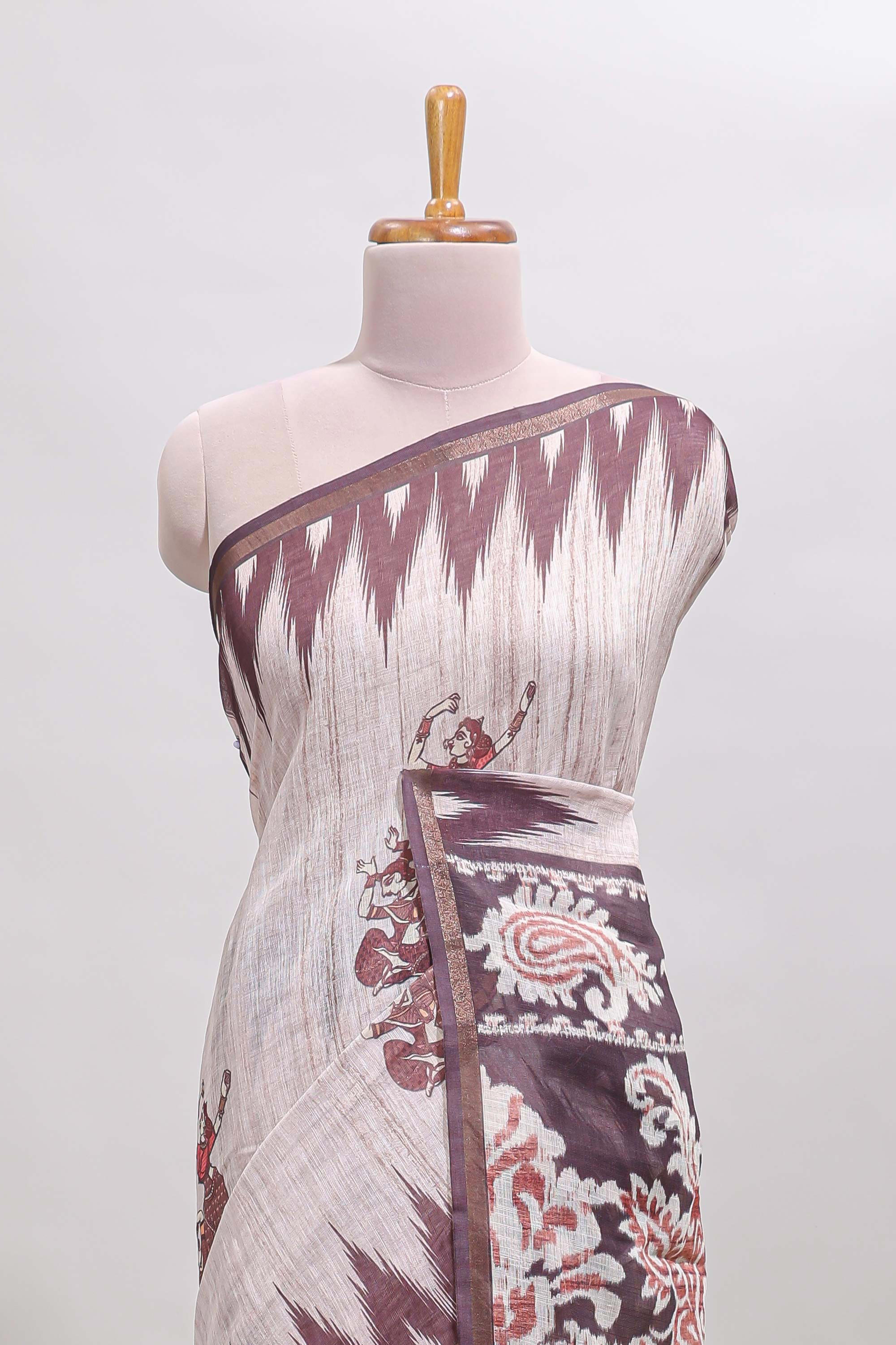 Off white tribal dance dance motifs linen cotton saree with contrast ikkat border and printed pallu