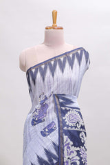 Lavender tribal dance dance motifs linen cotton saree with contrast ikkat border and printed pallu
