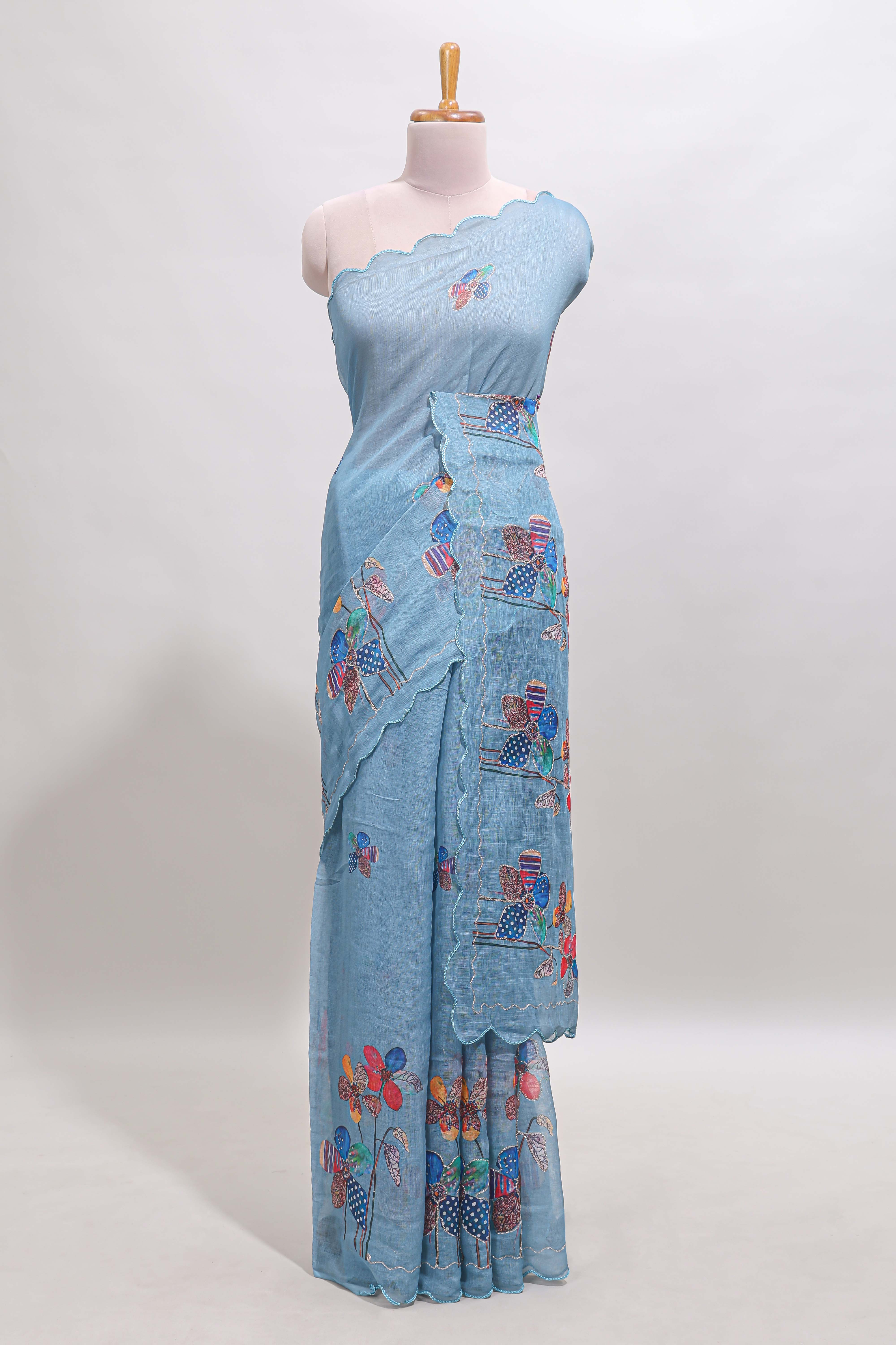 Blue floral design linen cotton saree with scallop border and matching printed blouse