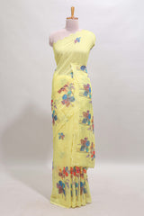 Yellow floral design linen cotton saree with scallop border and matching printed blouse