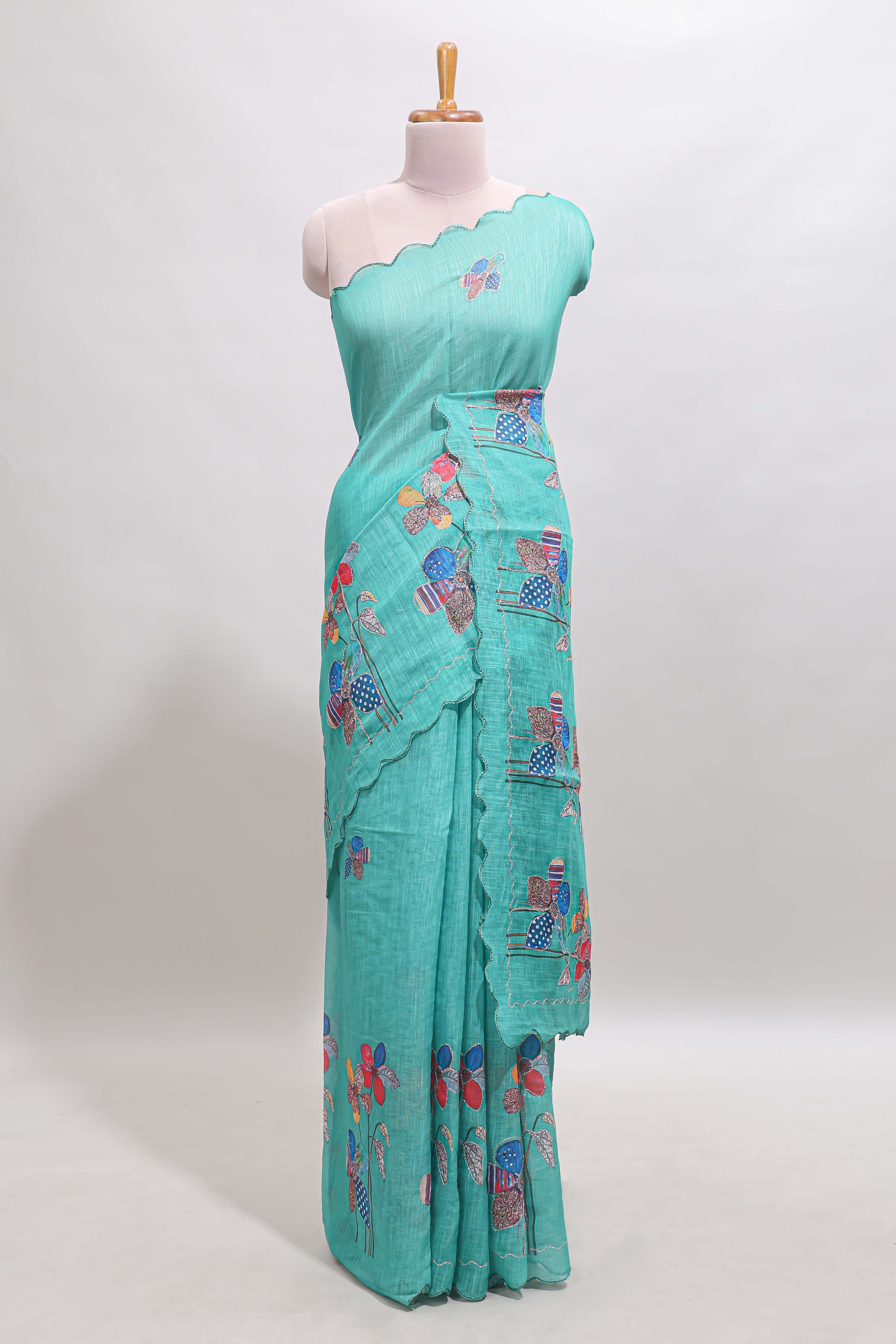Green floral design linen cotton saree with scallop border and matching printed blouse