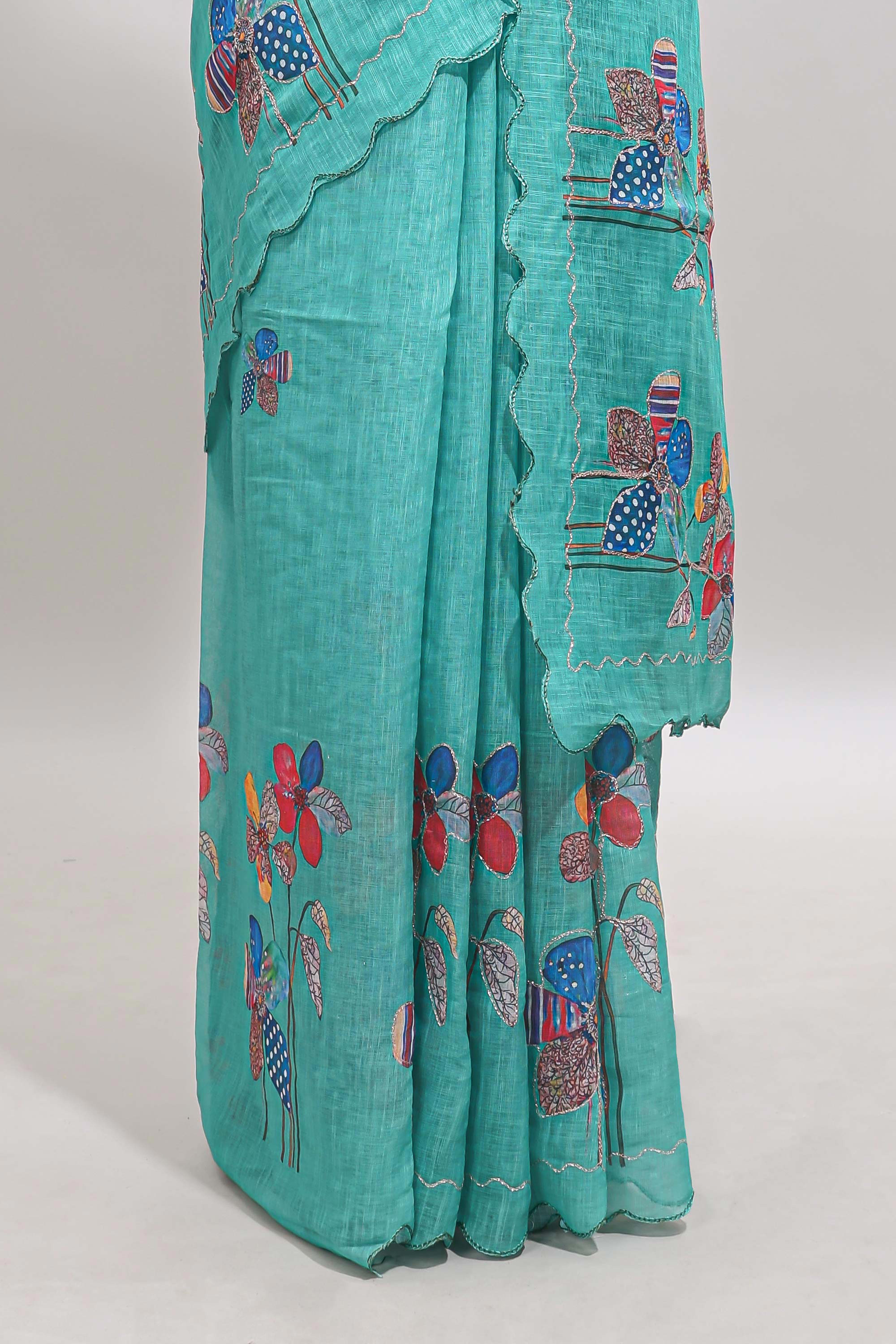 Green floral design linen cotton saree with scallop border and matching printed blouse
