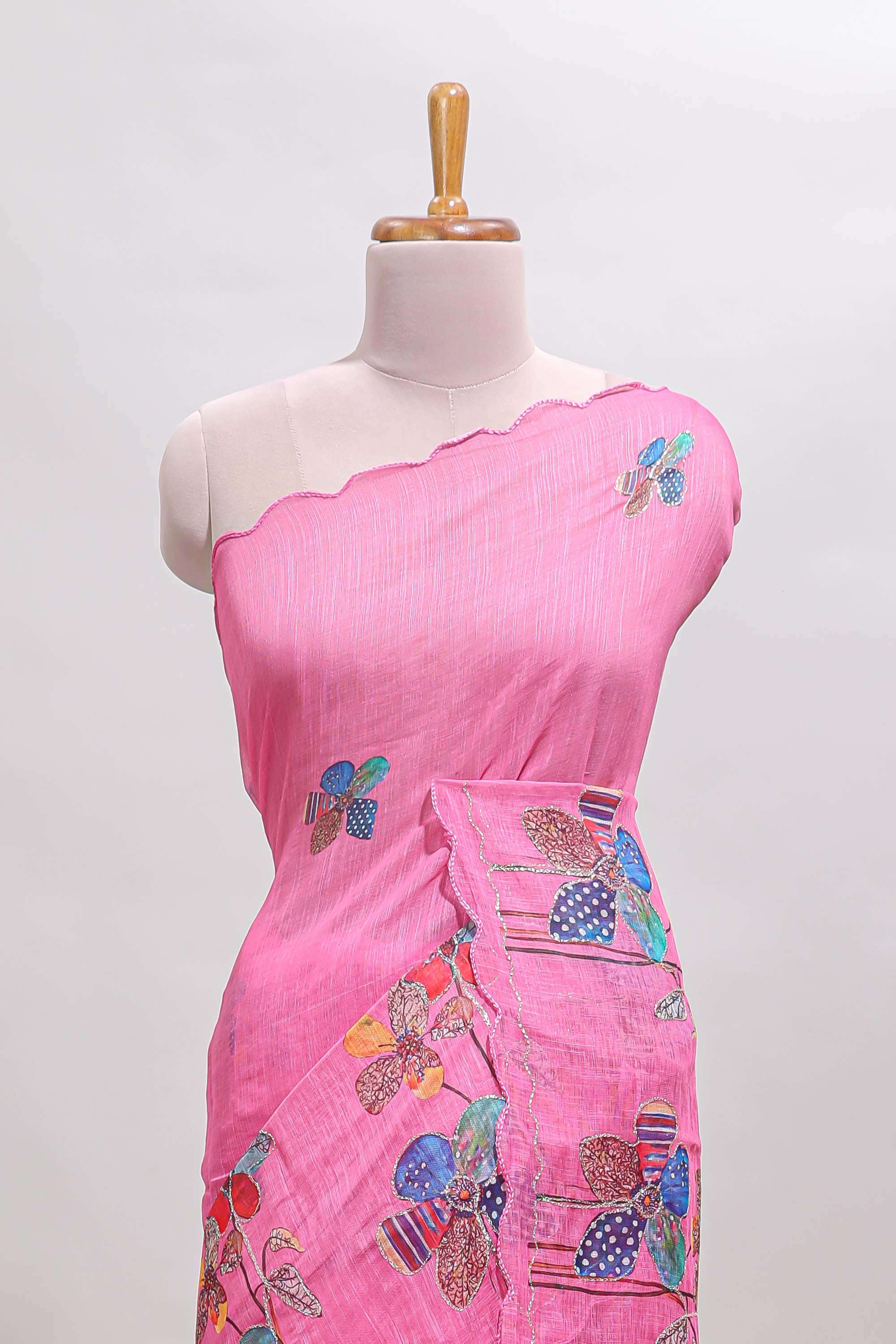 Pink floral design linen cotton saree with scallop border and matching printed blouse