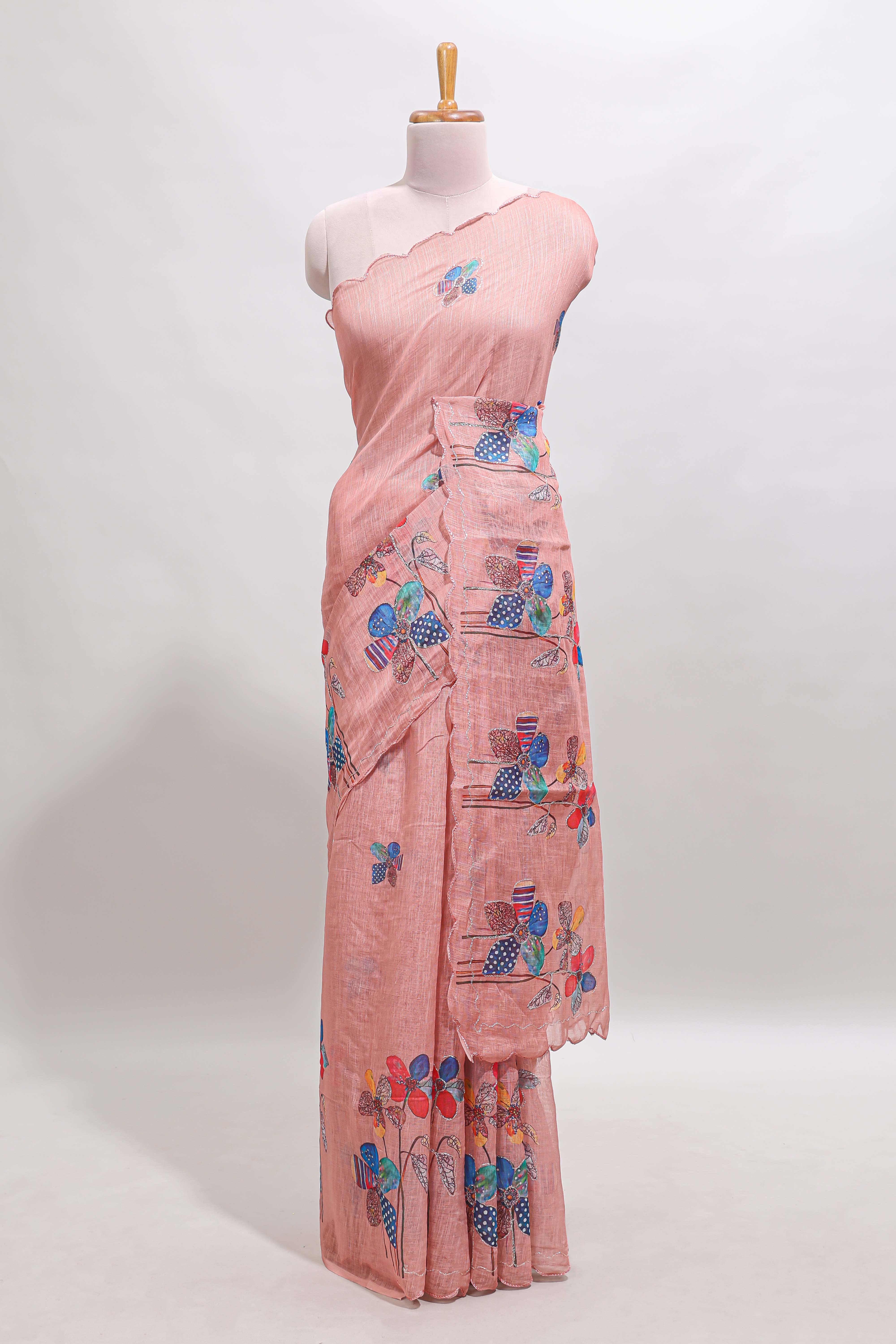Peach floral design linen cotton saree with scallop border and matching printed blouse