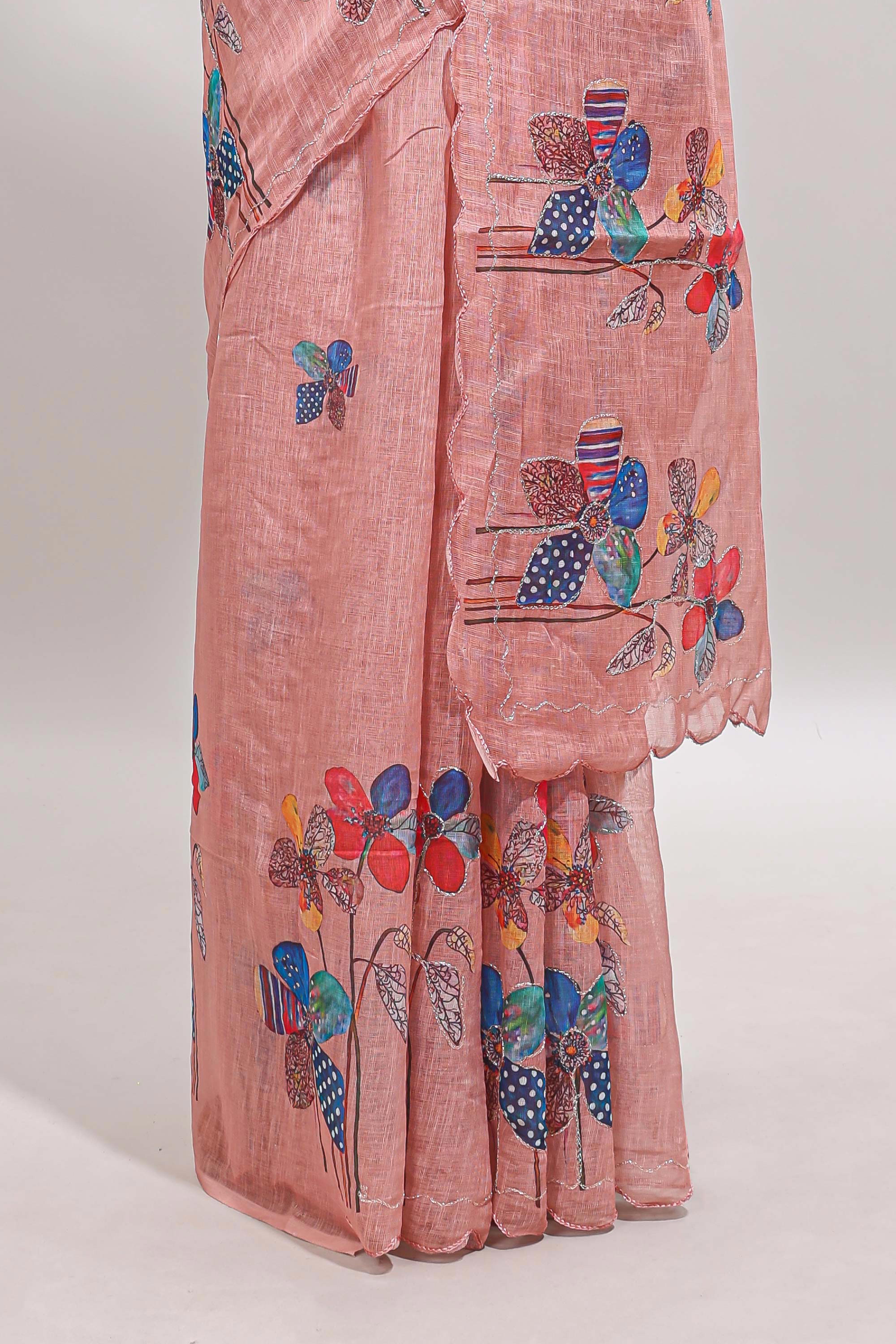 Peach floral design linen cotton saree with scallop border and matching printed blouse