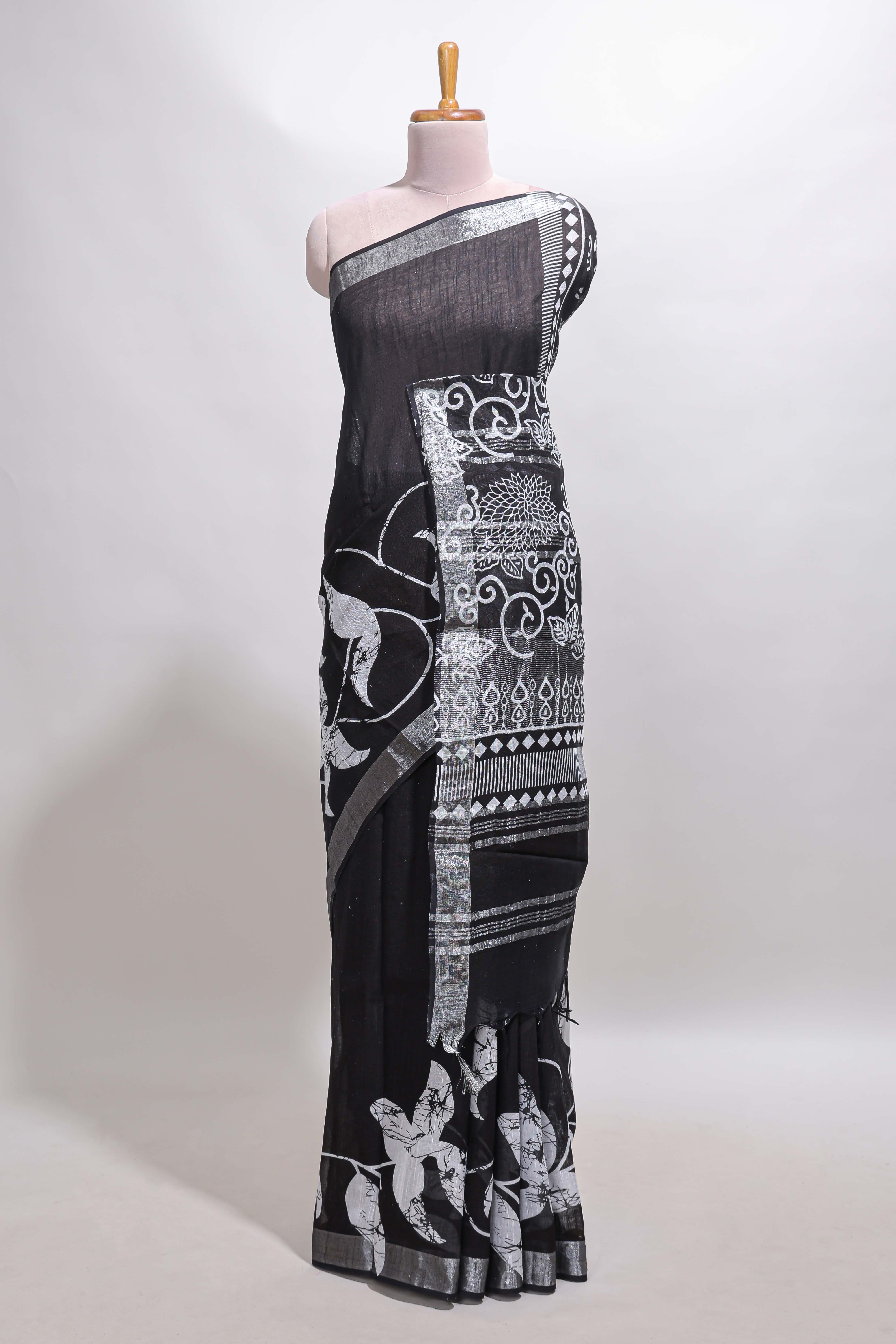 Black floral design linen cotton saree with self zari border and matching plain blouse
