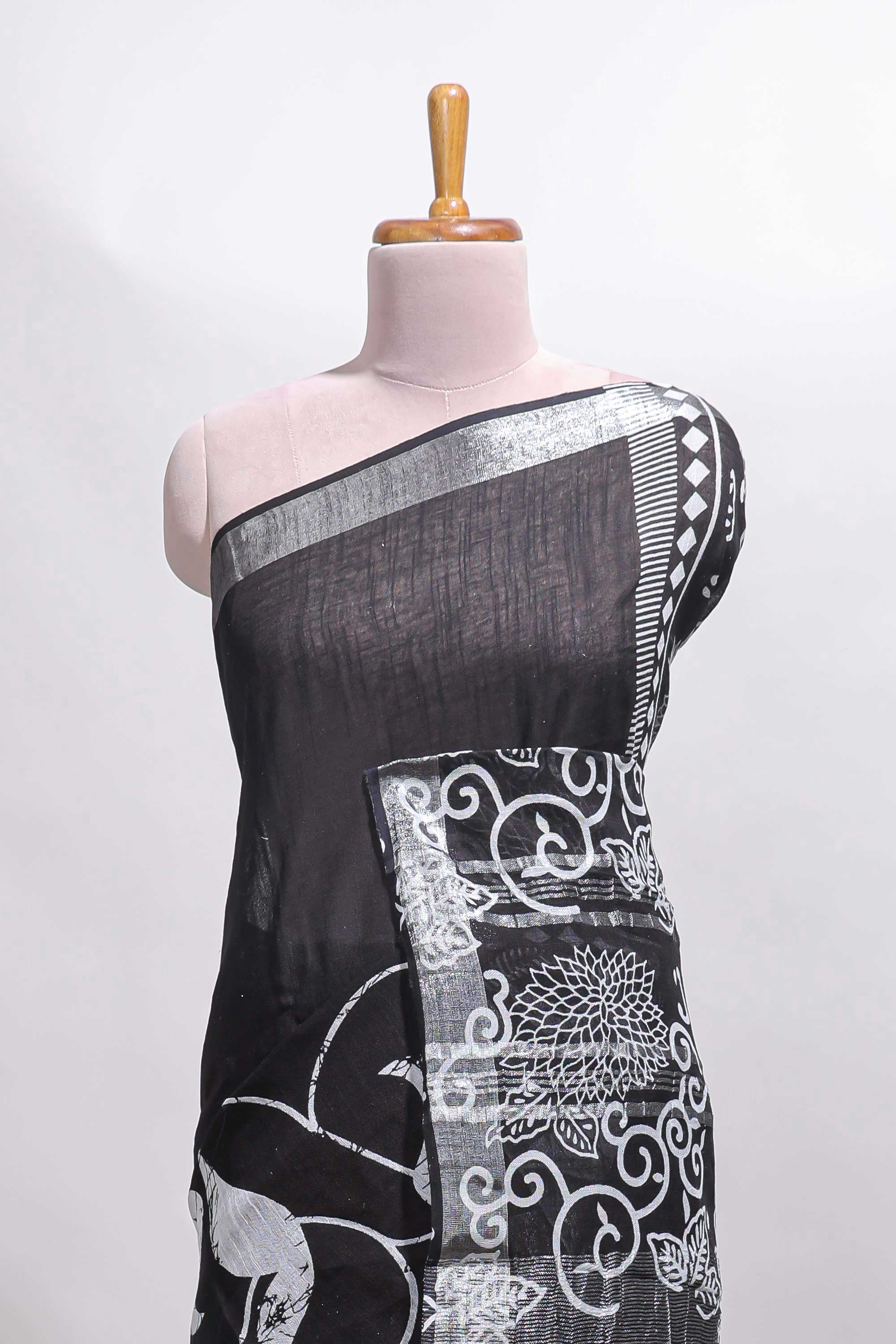 Black floral design linen cotton saree with self zari border and matching plain blouse
