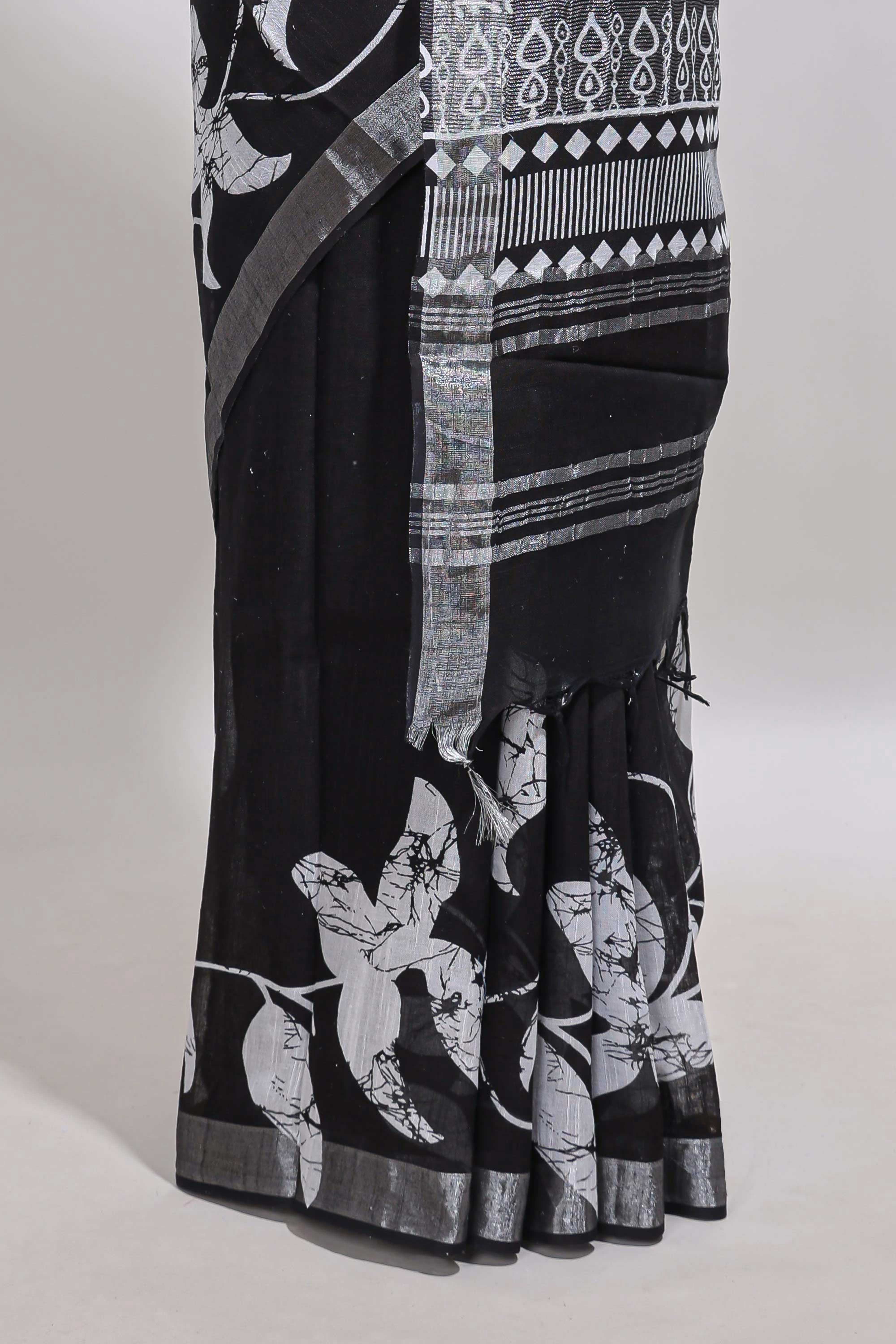 Black floral design linen cotton saree with self zari border and matching plain blouse
