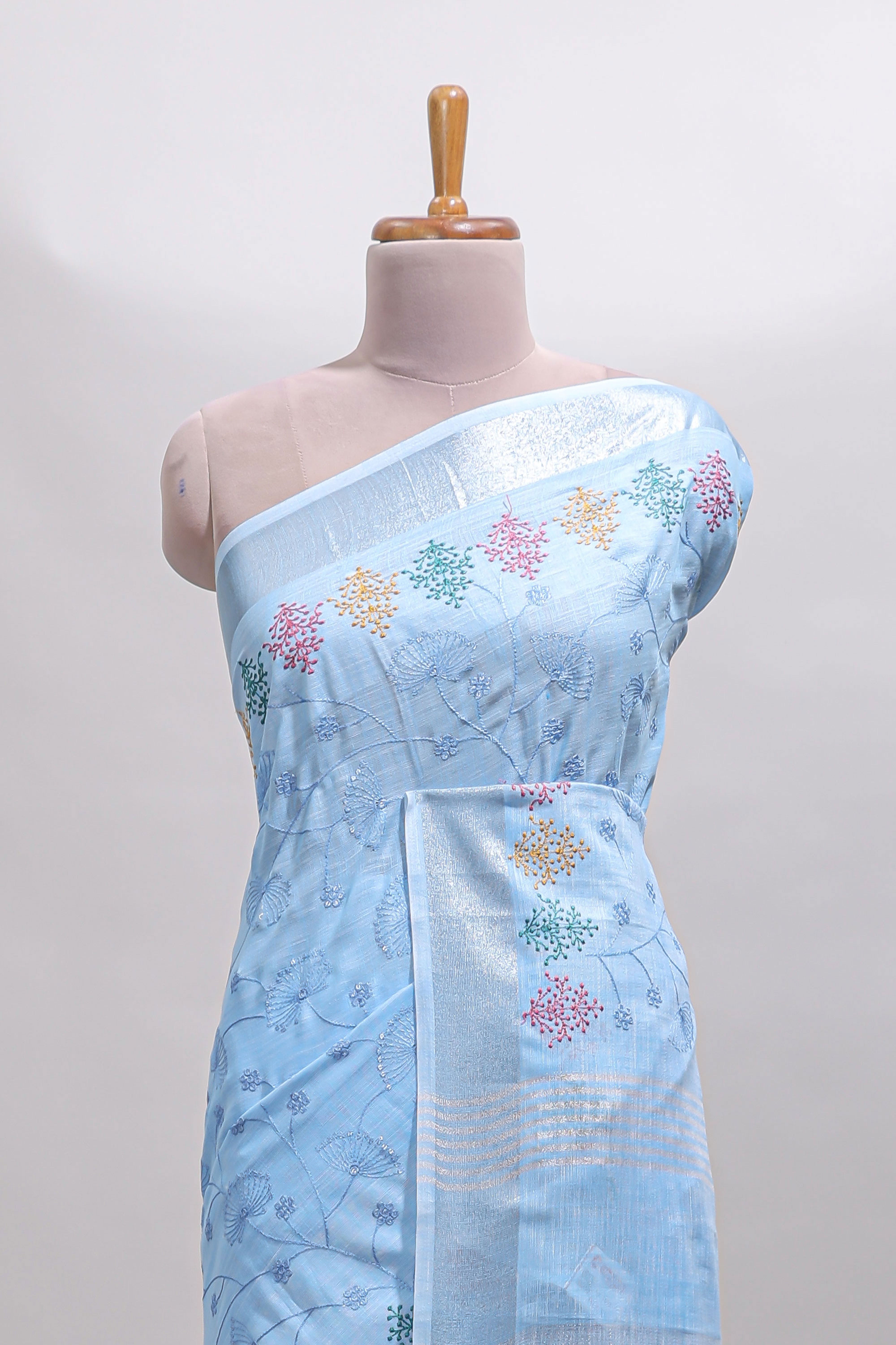 Blue embroidery floral design linen cotton saree with self zari border and matching blouse