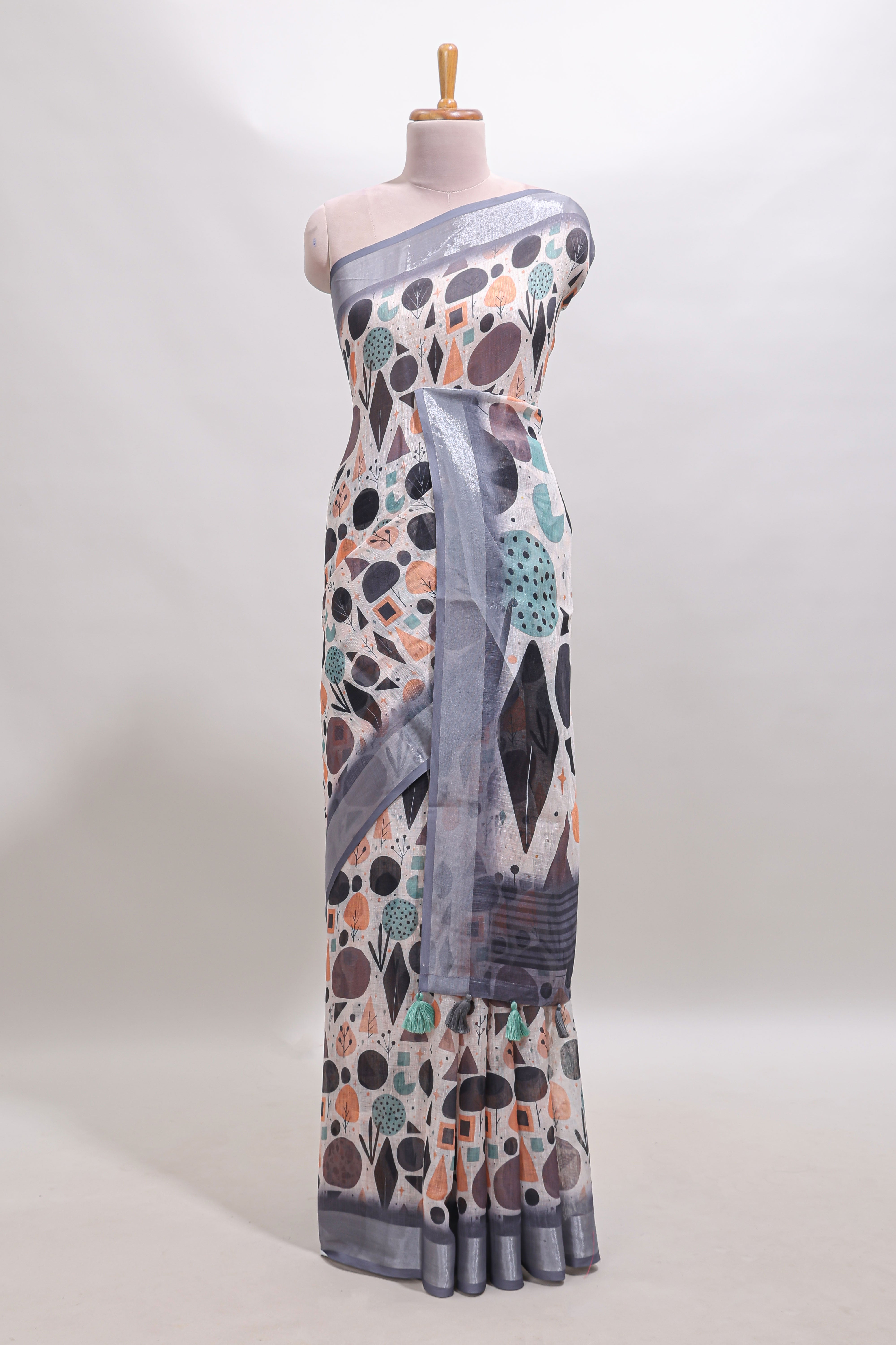 Beige geometric design linen cotton saree with contrast zari border and matching blouse