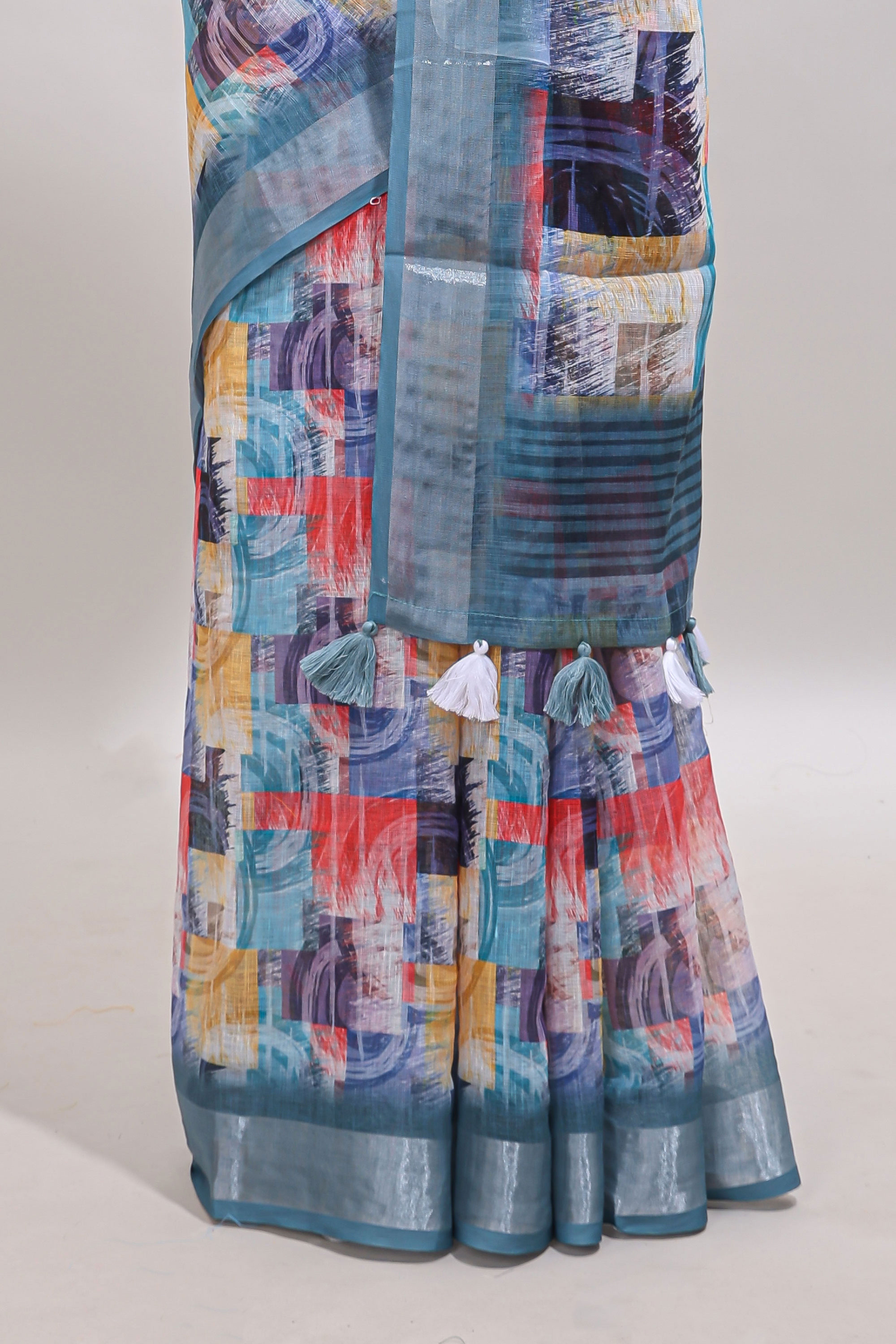 Multi color geometric design linen cotton saree with contrast zari border and matching blouse