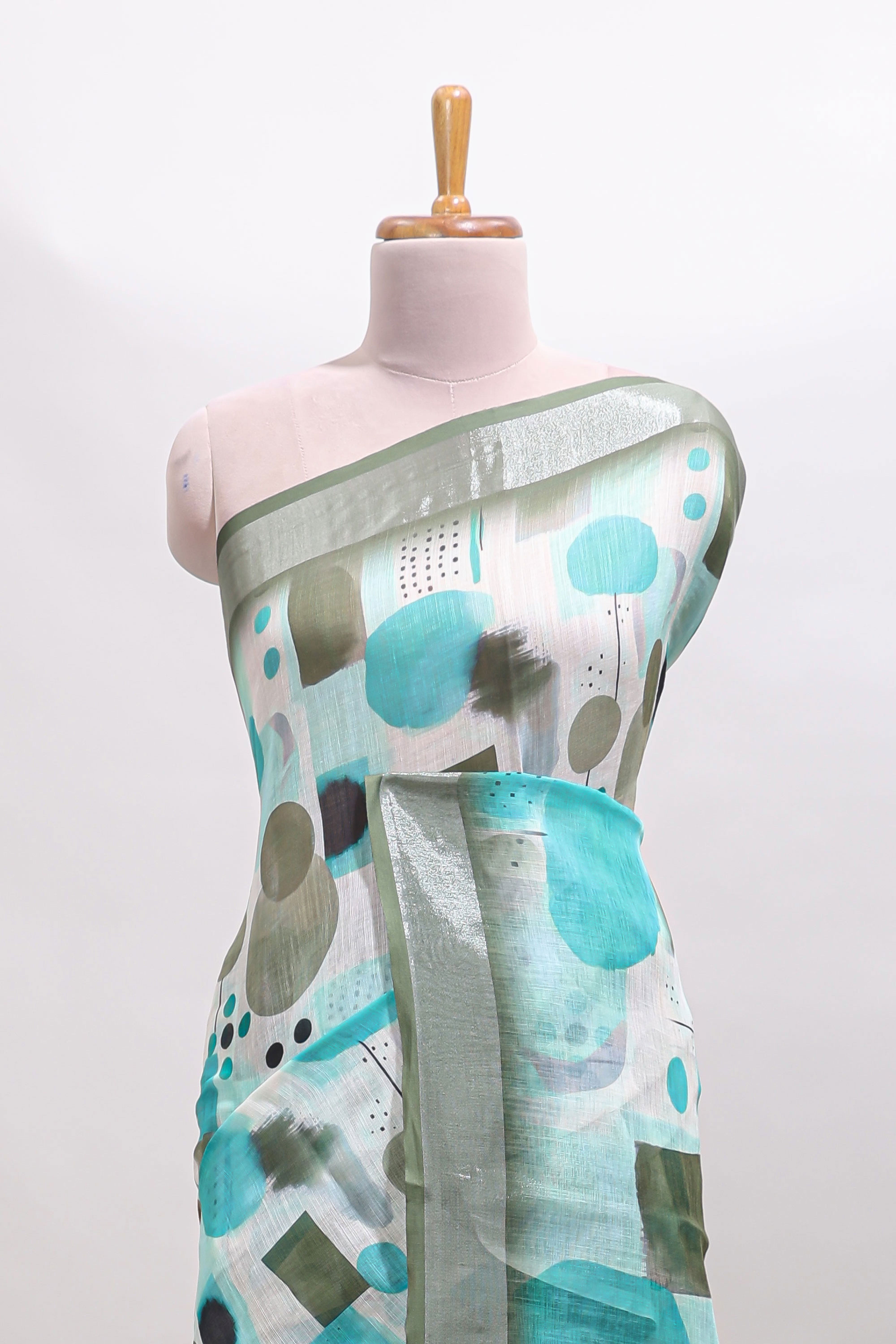 Multi color geometric design linen cotton saree with contrast zari border and matching blouse