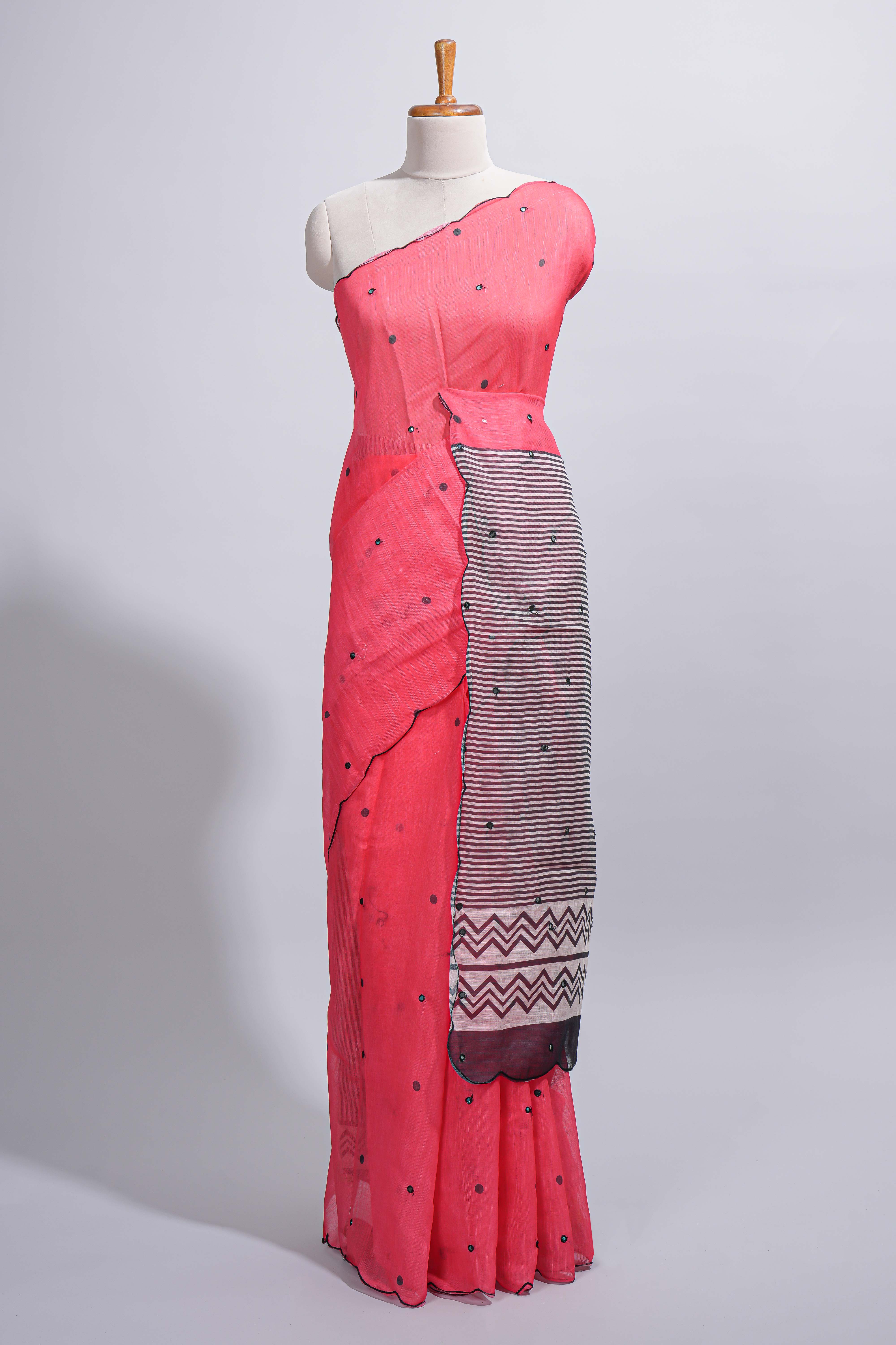 Coral pink linen cotton saree withsequin details striped and geometric zigzag pallu with scallop border along with striped blouse