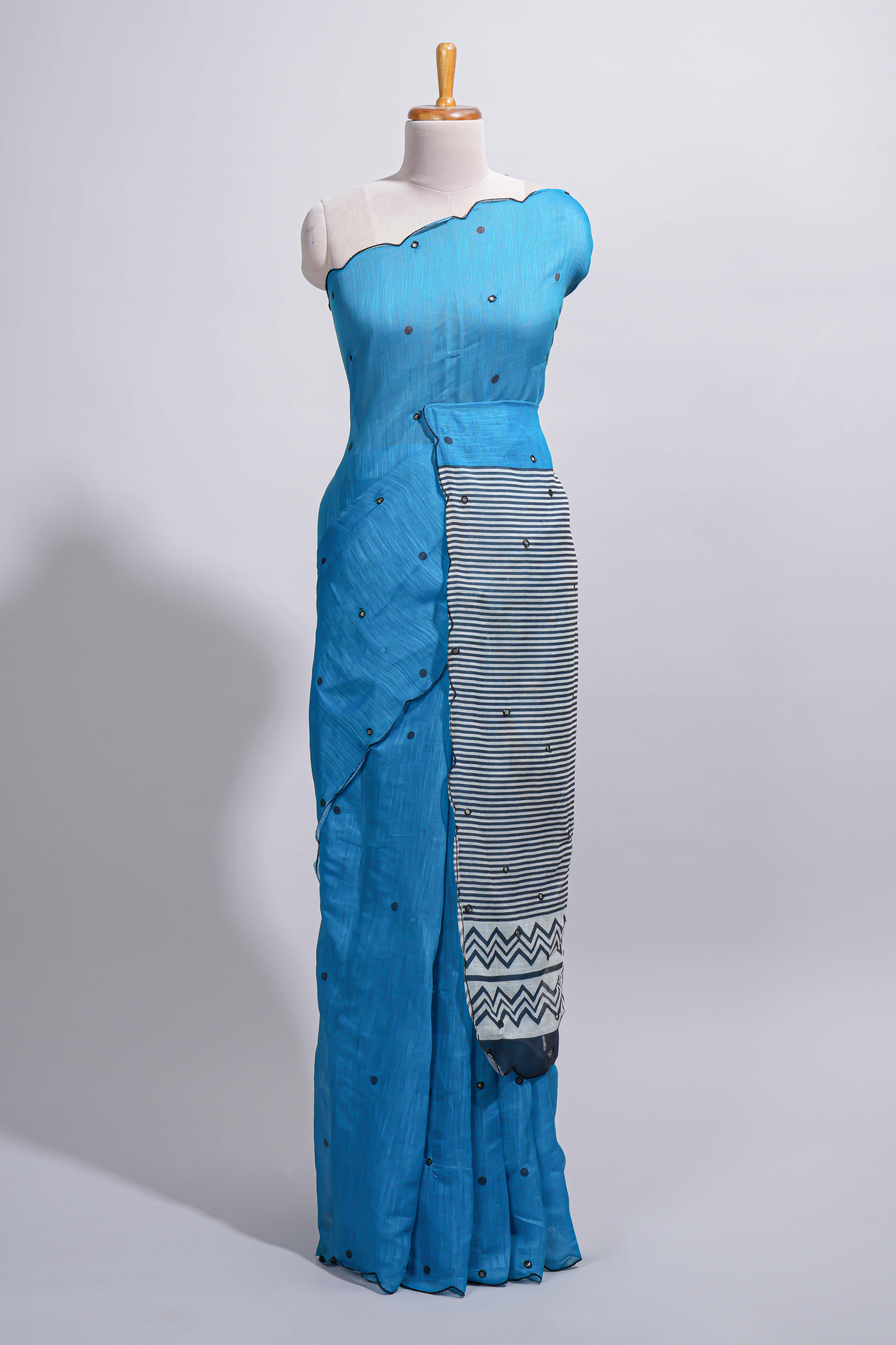 Blue linen cotton saree withsequin details striped and geometric zigzag pallu with scallop border along with striped blouse