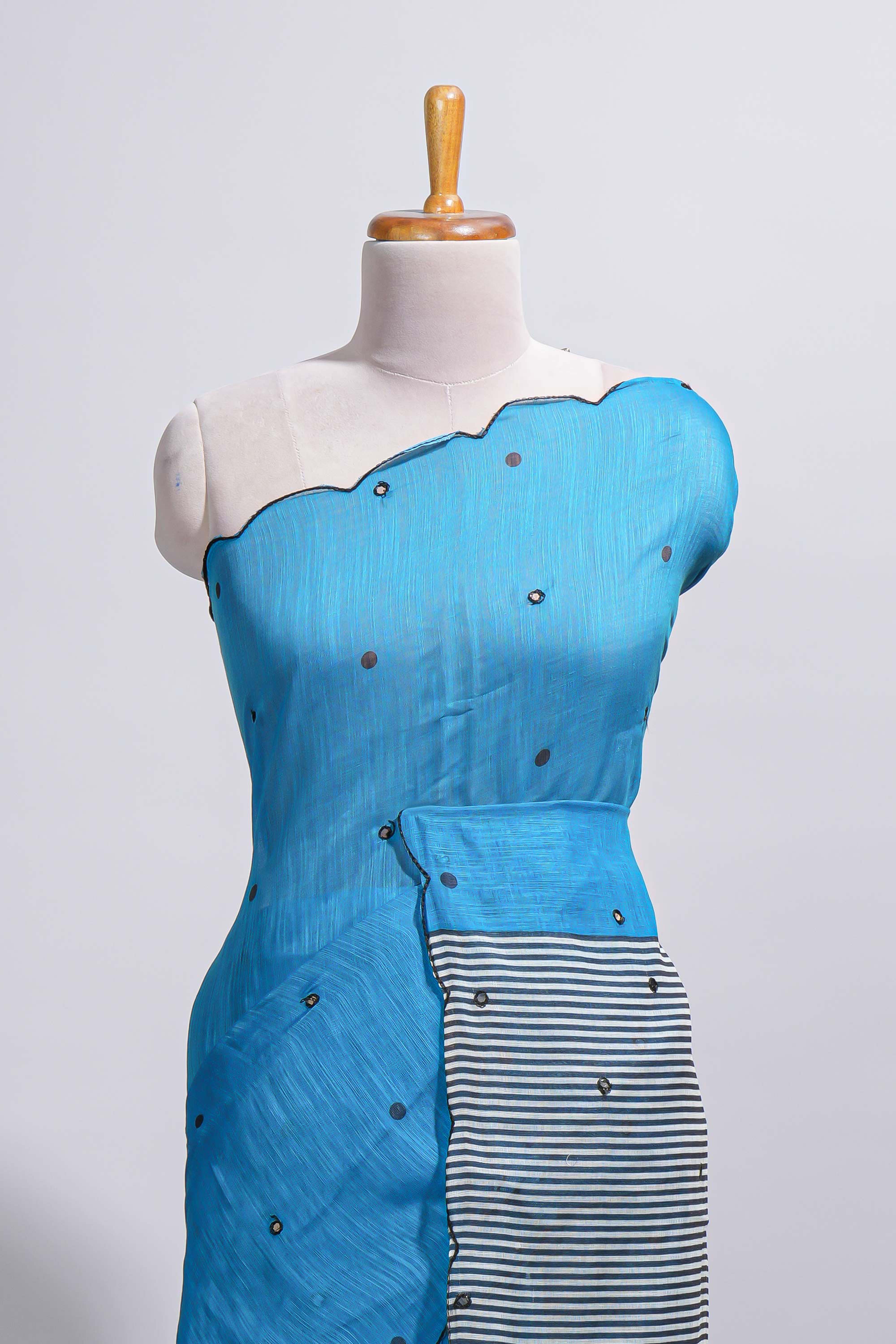 Blue linen cotton saree withsequin details striped and geometric zigzag pallu with scallop border along with striped blouse