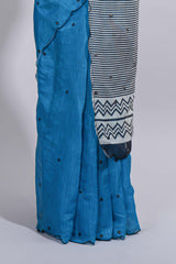 Blue linen cotton saree withsequin details striped and geometric zigzag pallu with scallop border along with striped blouse