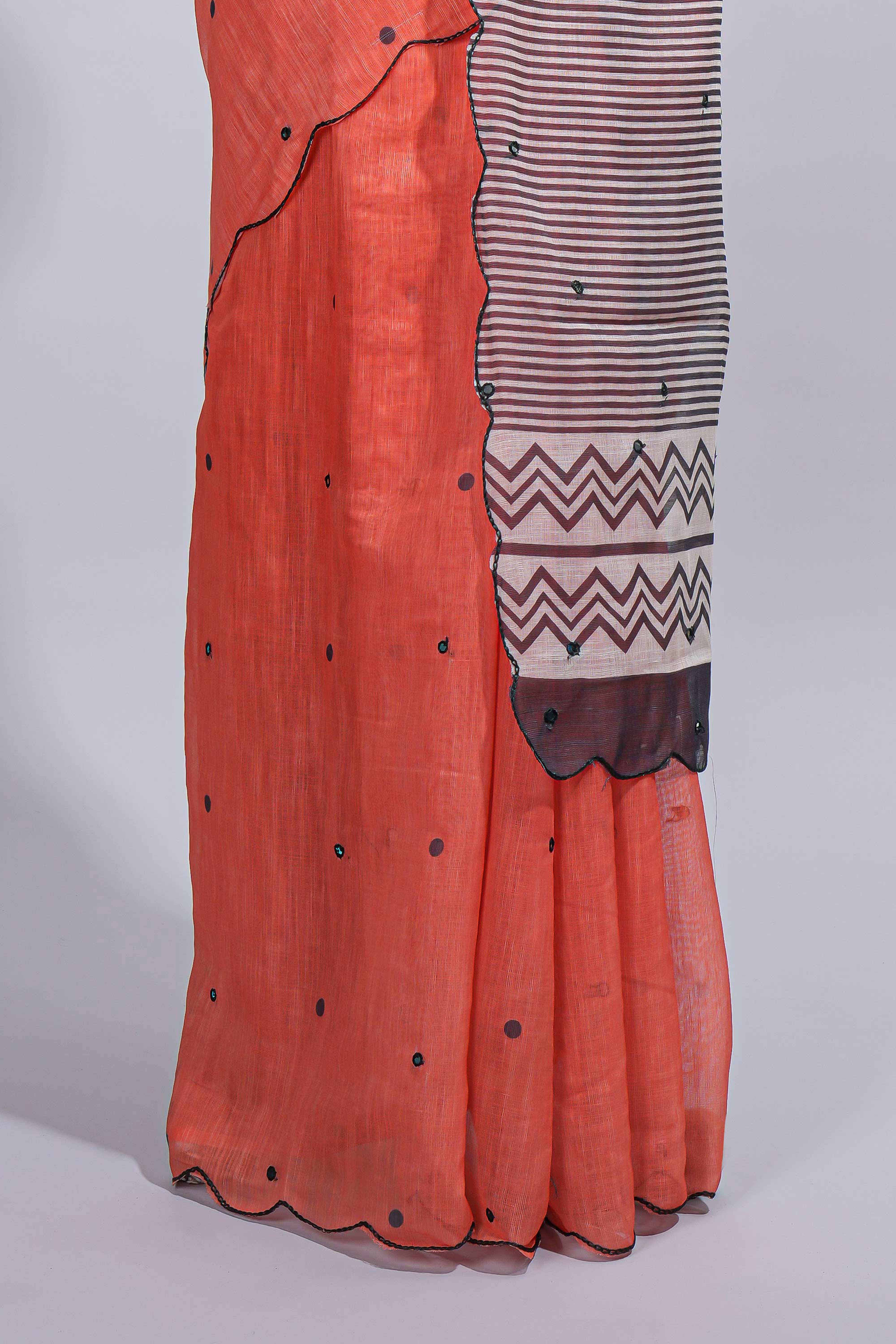 Orange linen cotton saree withsequin details striped and geometric zigzag pallu with scallop border along with striped blouse