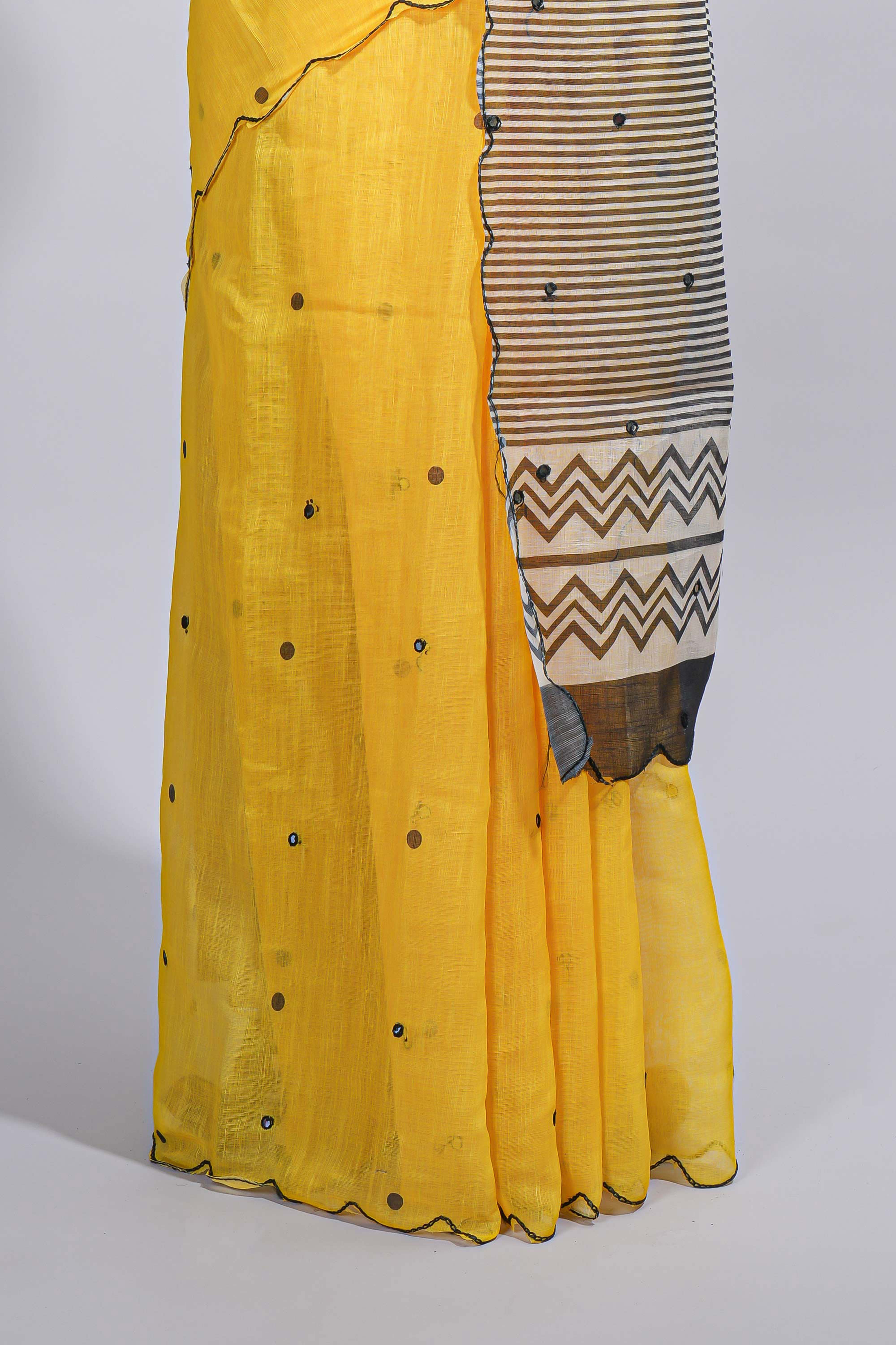 Yellow linen cotton saree withsequin details striped and geometric zigzag pallu with scallop border along with striped blouse