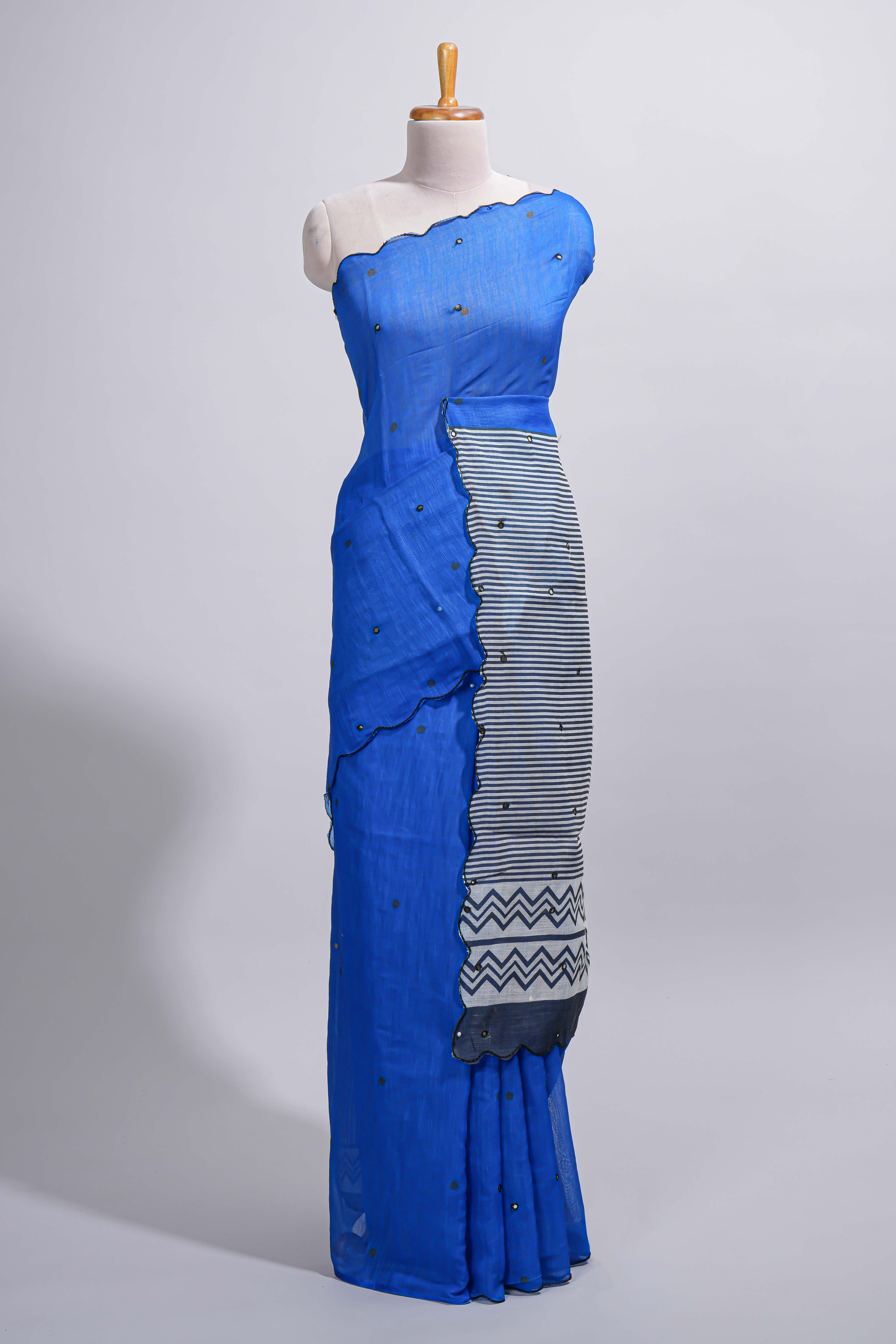 Royal blue linen cotton saree withsequin details striped and geometric zigzag pallu with scallop border along with striped blouse