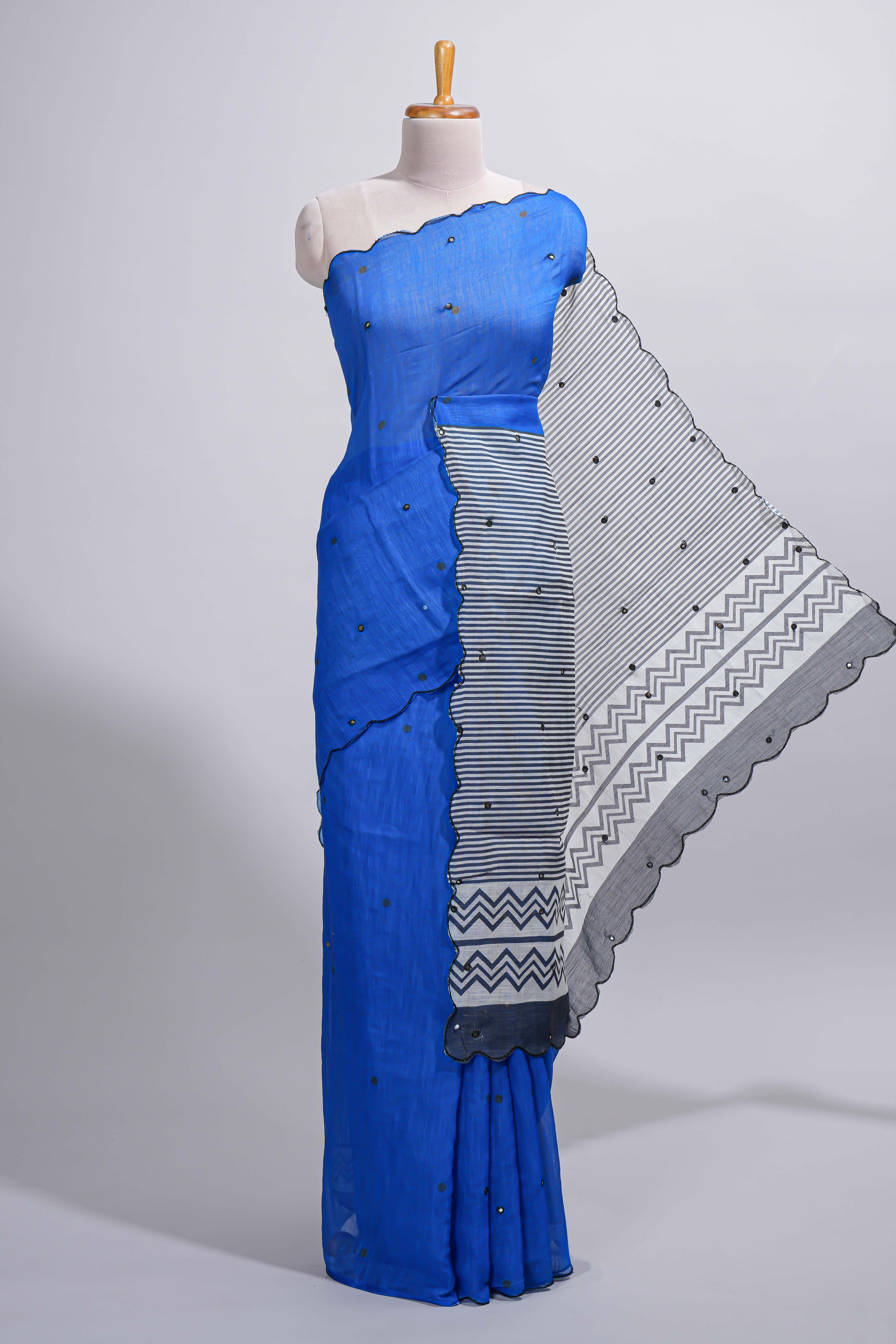 Royal blue linen cotton saree withsequin details striped and geometric zigzag pallu with scallop border along with striped blouse