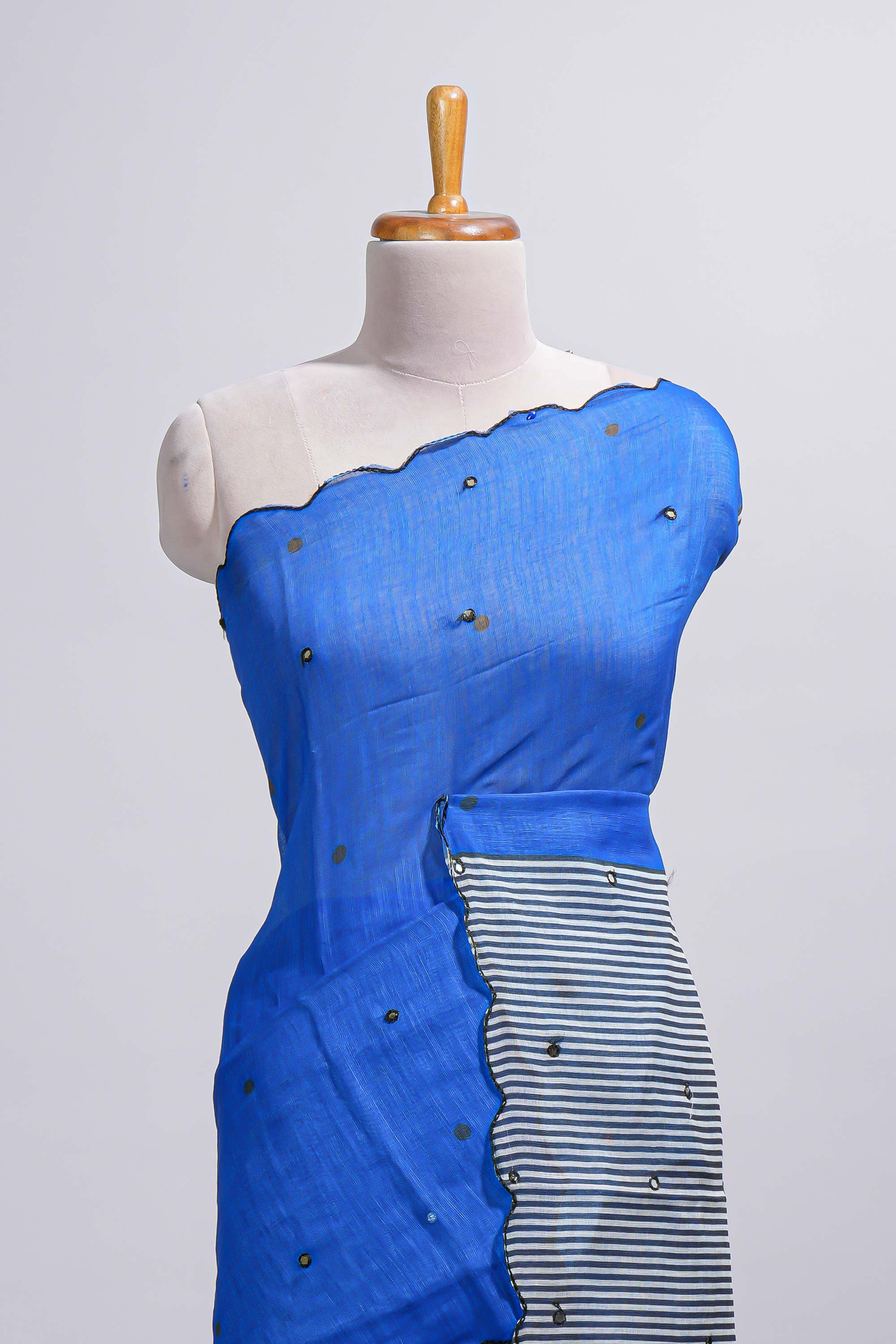 Royal blue linen cotton saree withsequin details striped and geometric zigzag pallu with scallop border along with striped blouse