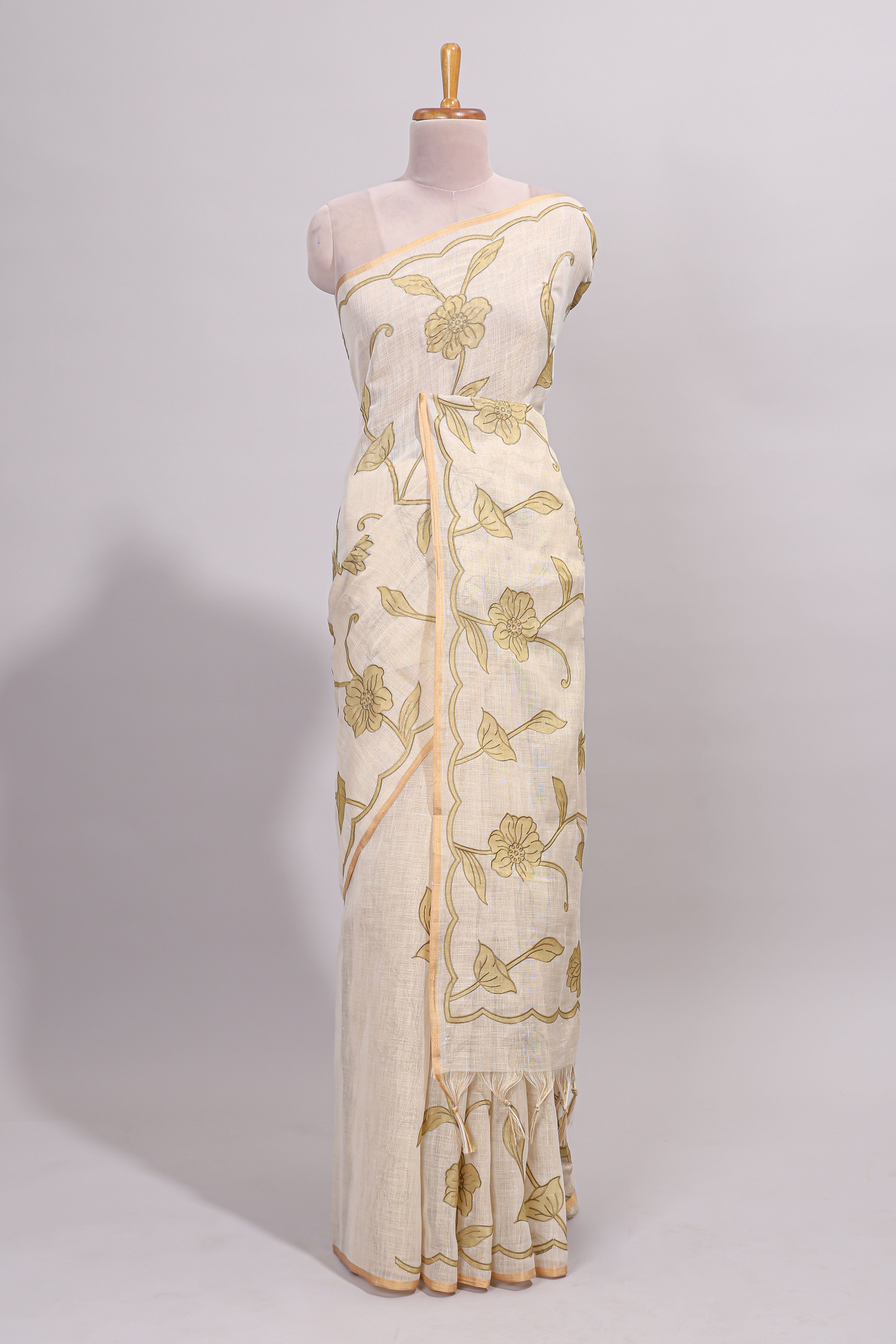 Cream floral design linen cotton saree with self zari border and matching printed blouse