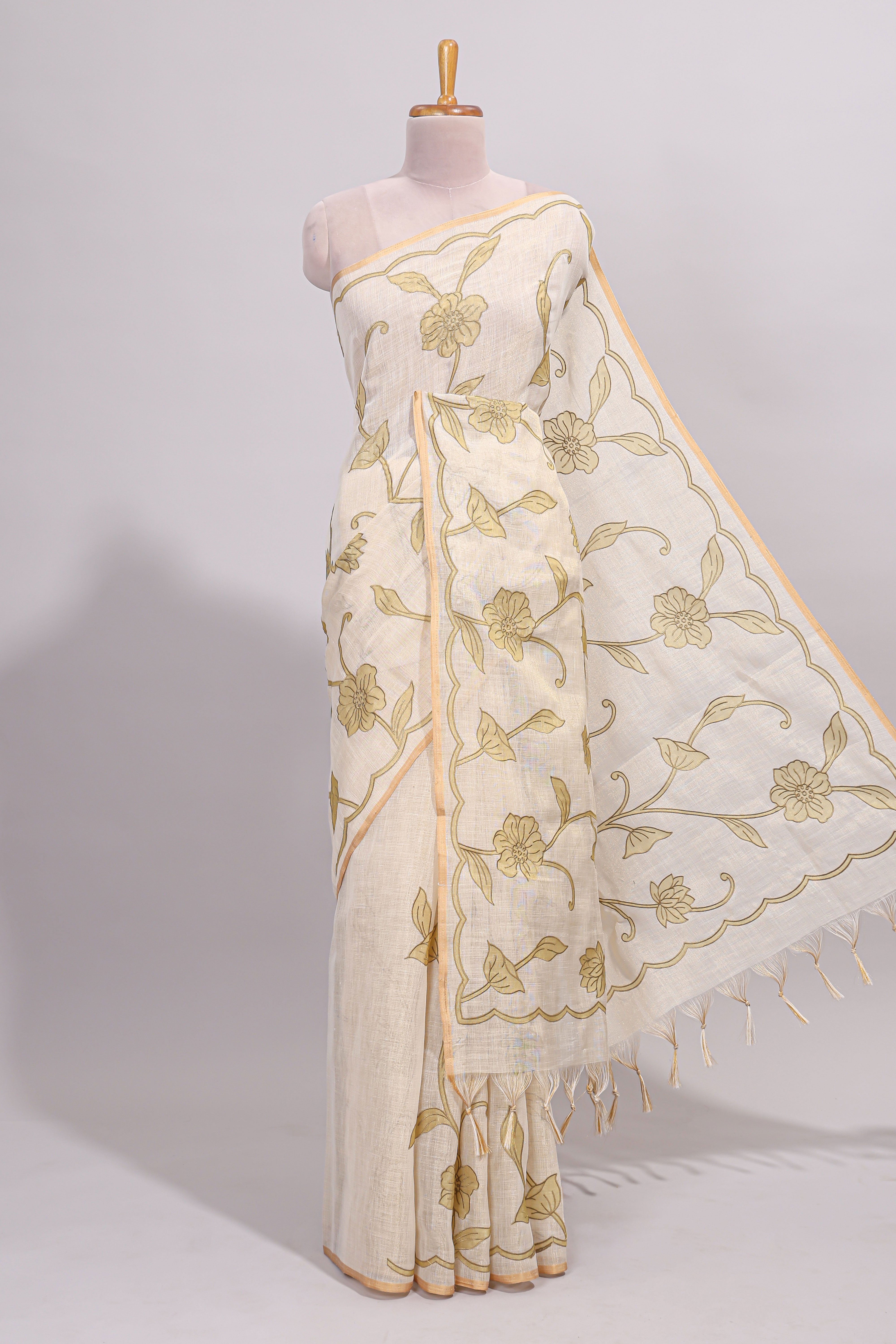 Cream floral design linen cotton saree with self zari border and matching printed blouse