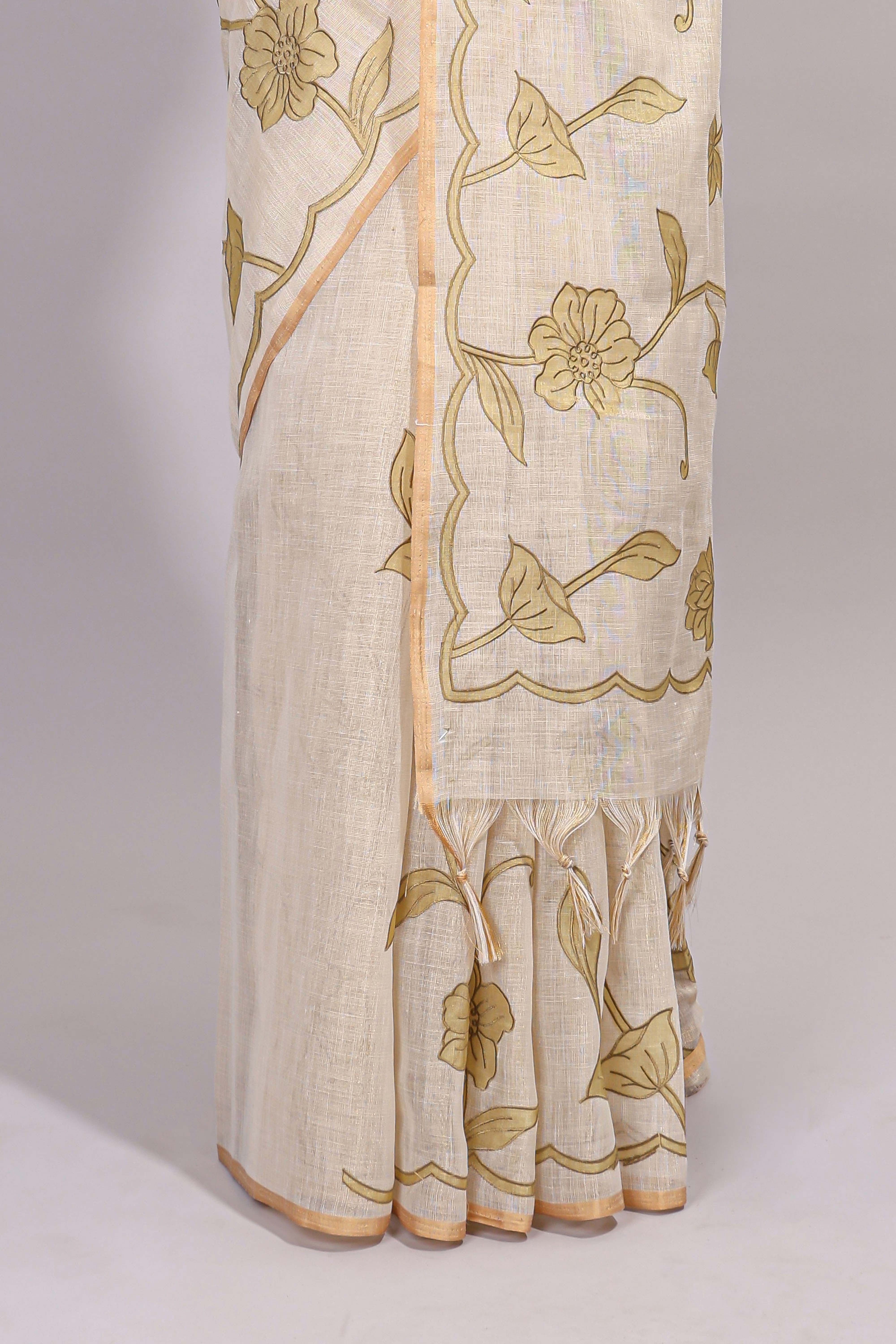 Cream floral design linen cotton saree with self zari border and matching printed blouse