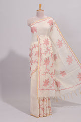 Cream floral design linen cotton saree with self zari border and contrast printed blouse