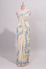 Cream floral design linen cotton saree with self zari border and matching printed blouse